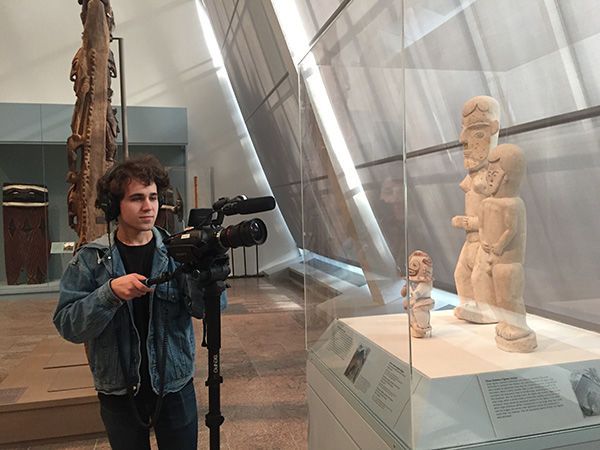 Intern filming objects in the galleries