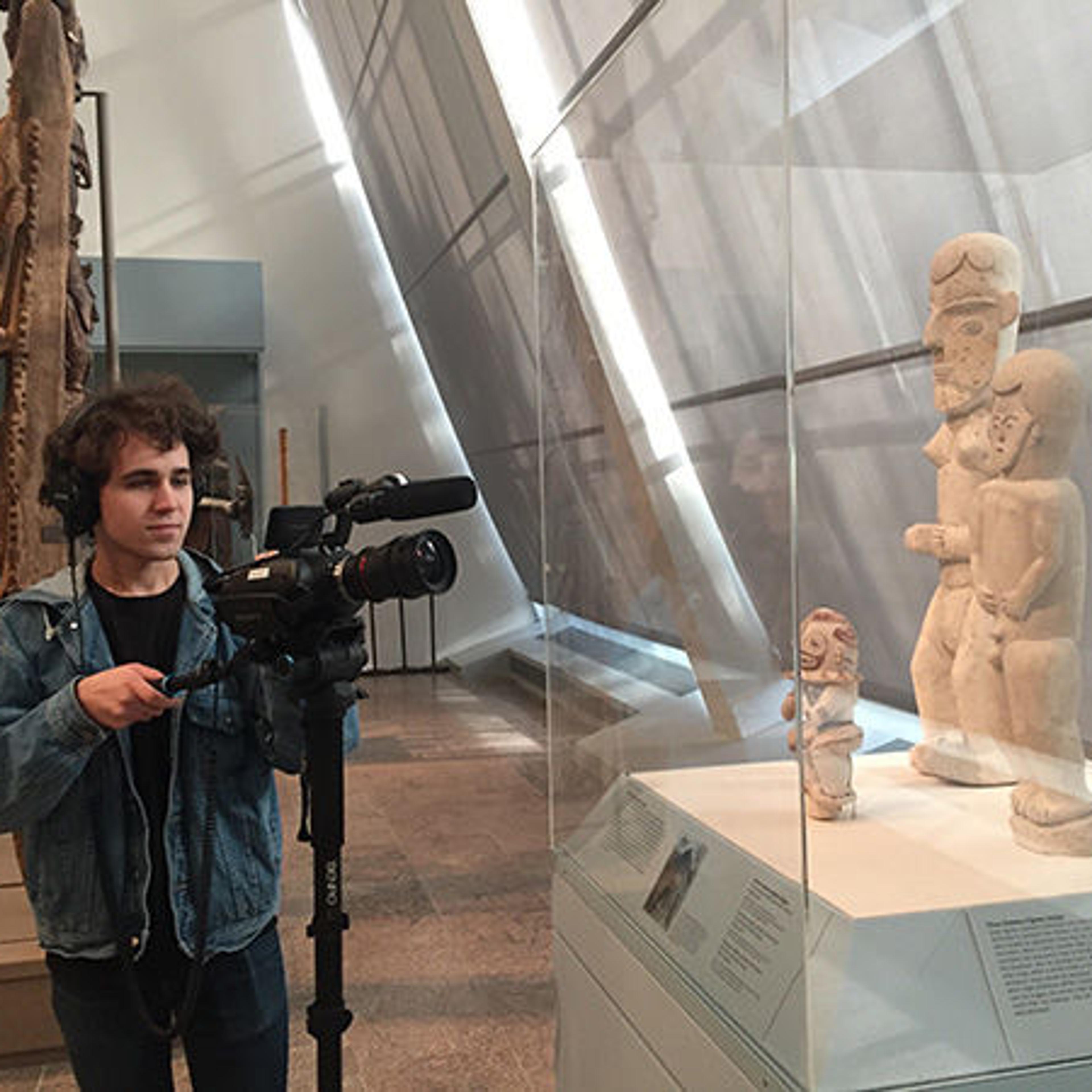 Intern filming objects in the galleries