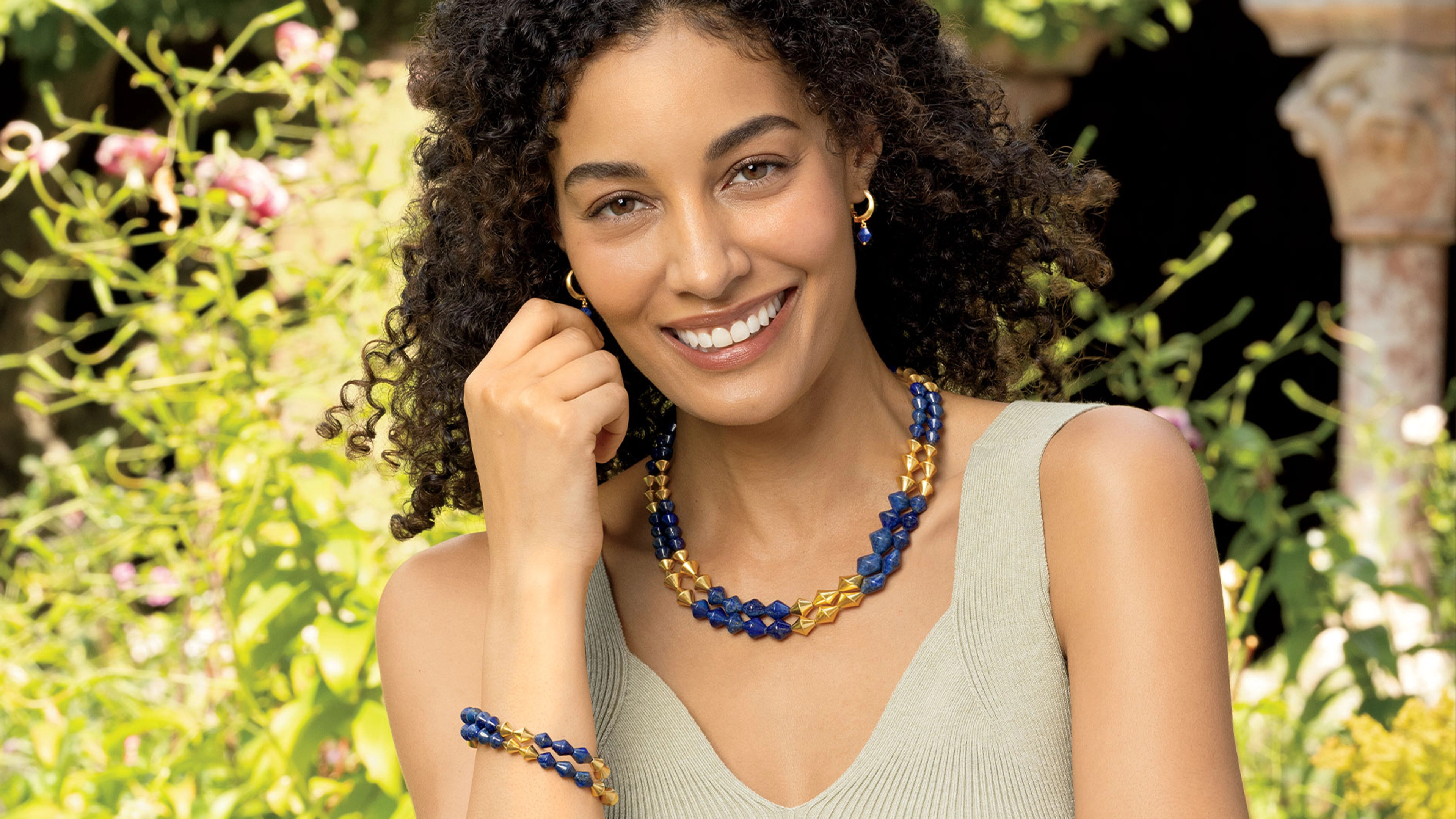 A woman wearing colorful jewelry. 