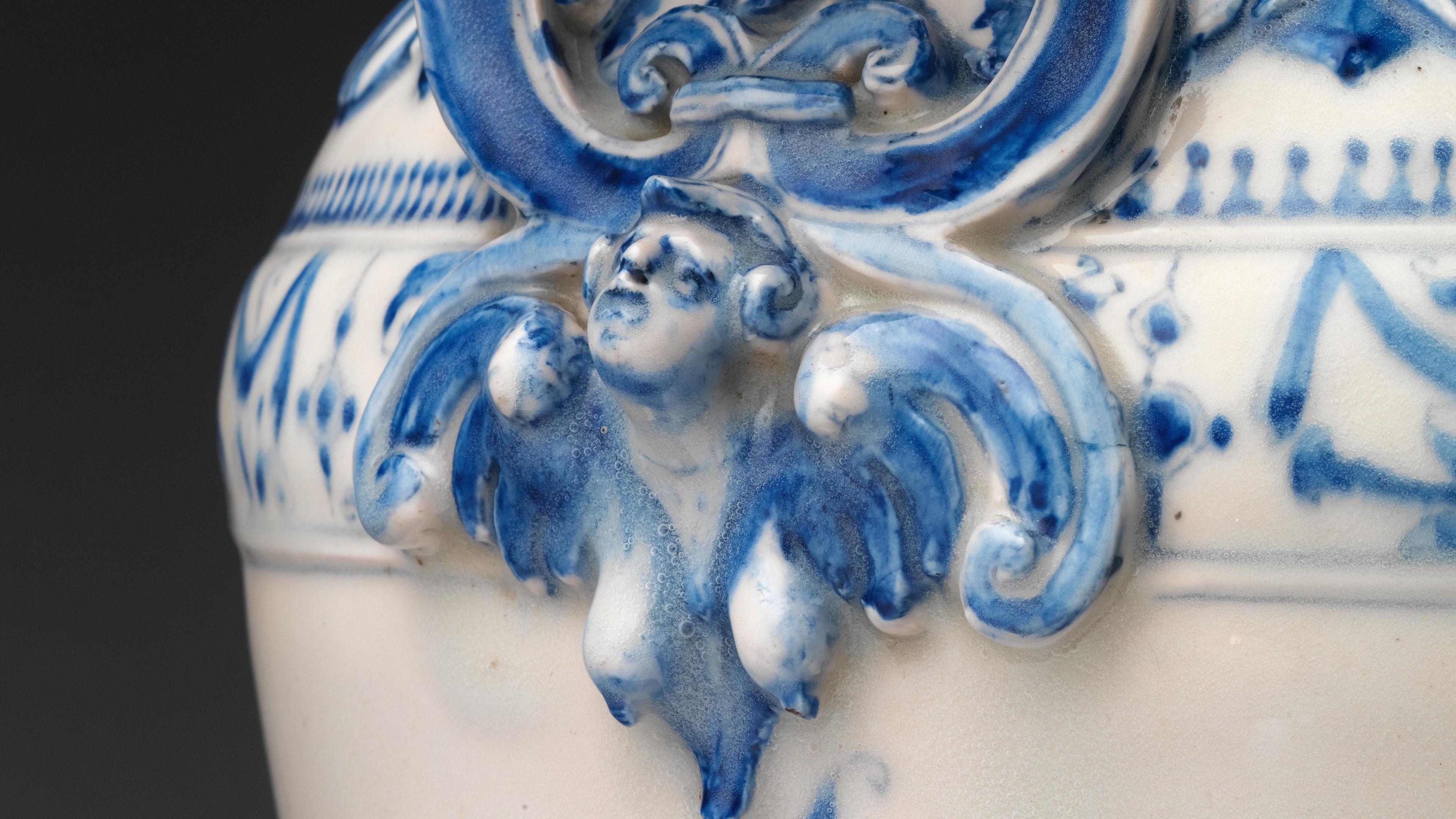 An angelic sculpture decorating a pot