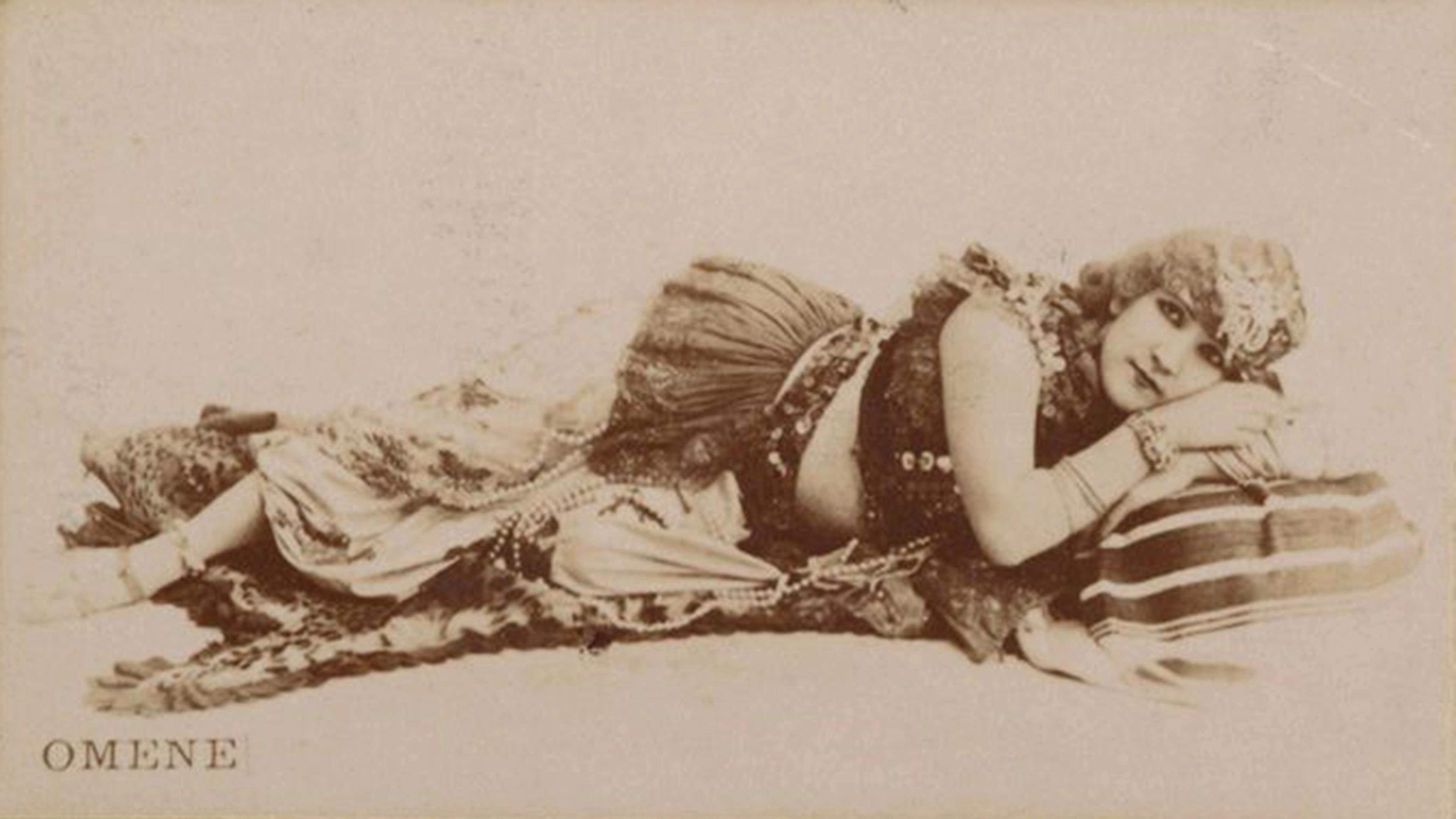 Portrait of Omene lying horizontally, arms folded under her head