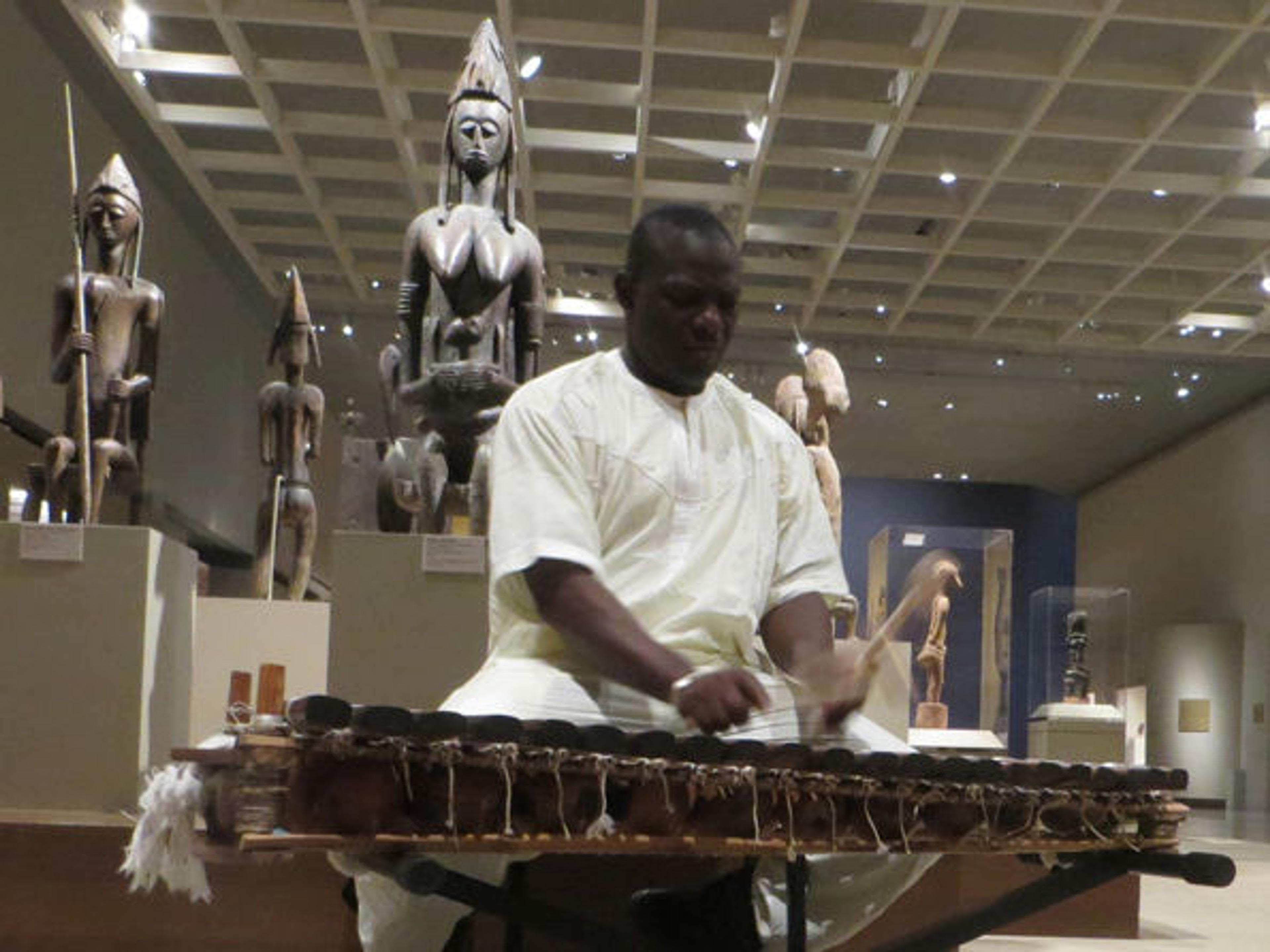 Famoro Dioubate performs in the Museum's African Art galleries