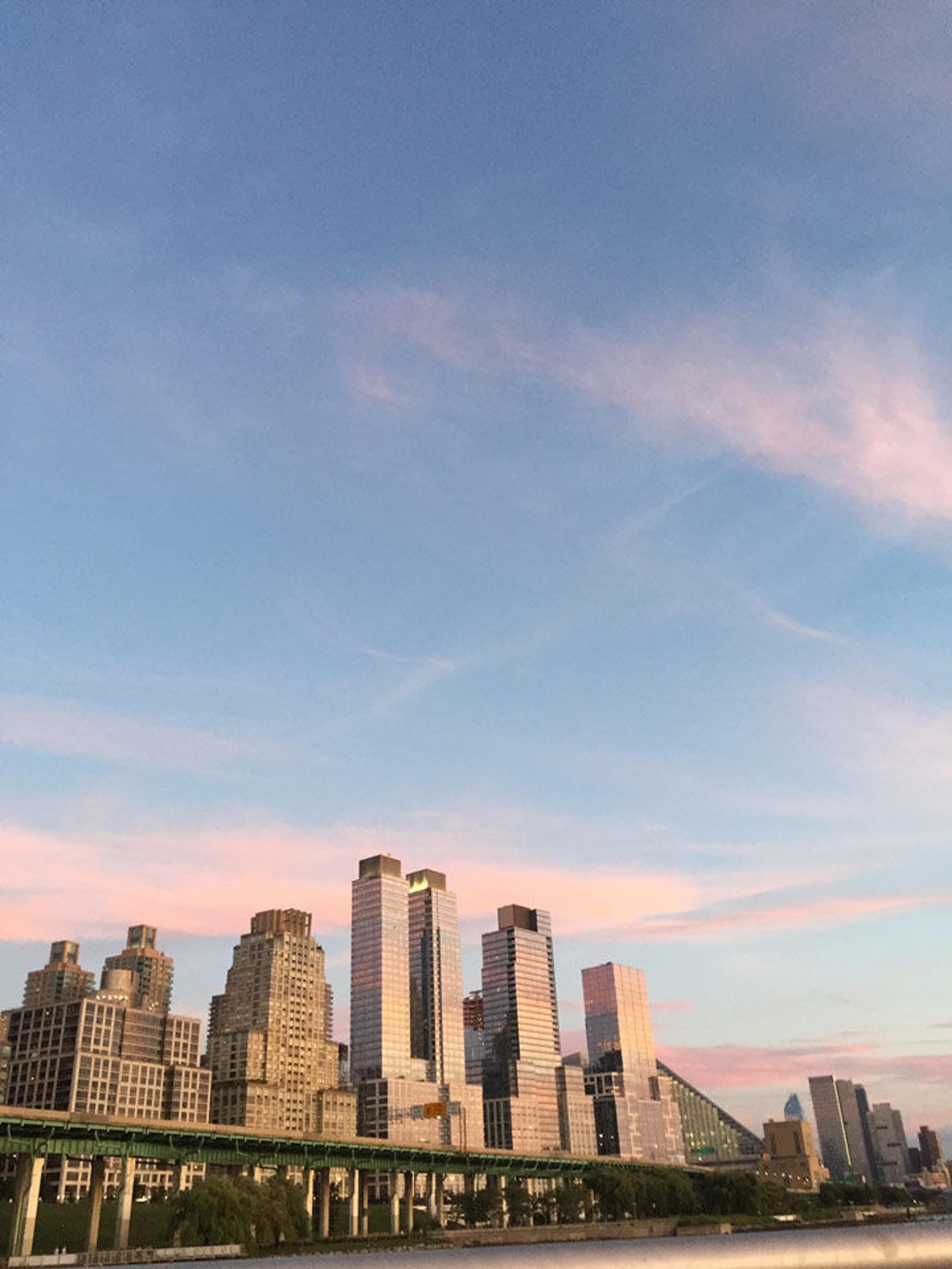 The Manhattan skyline against a blue sky