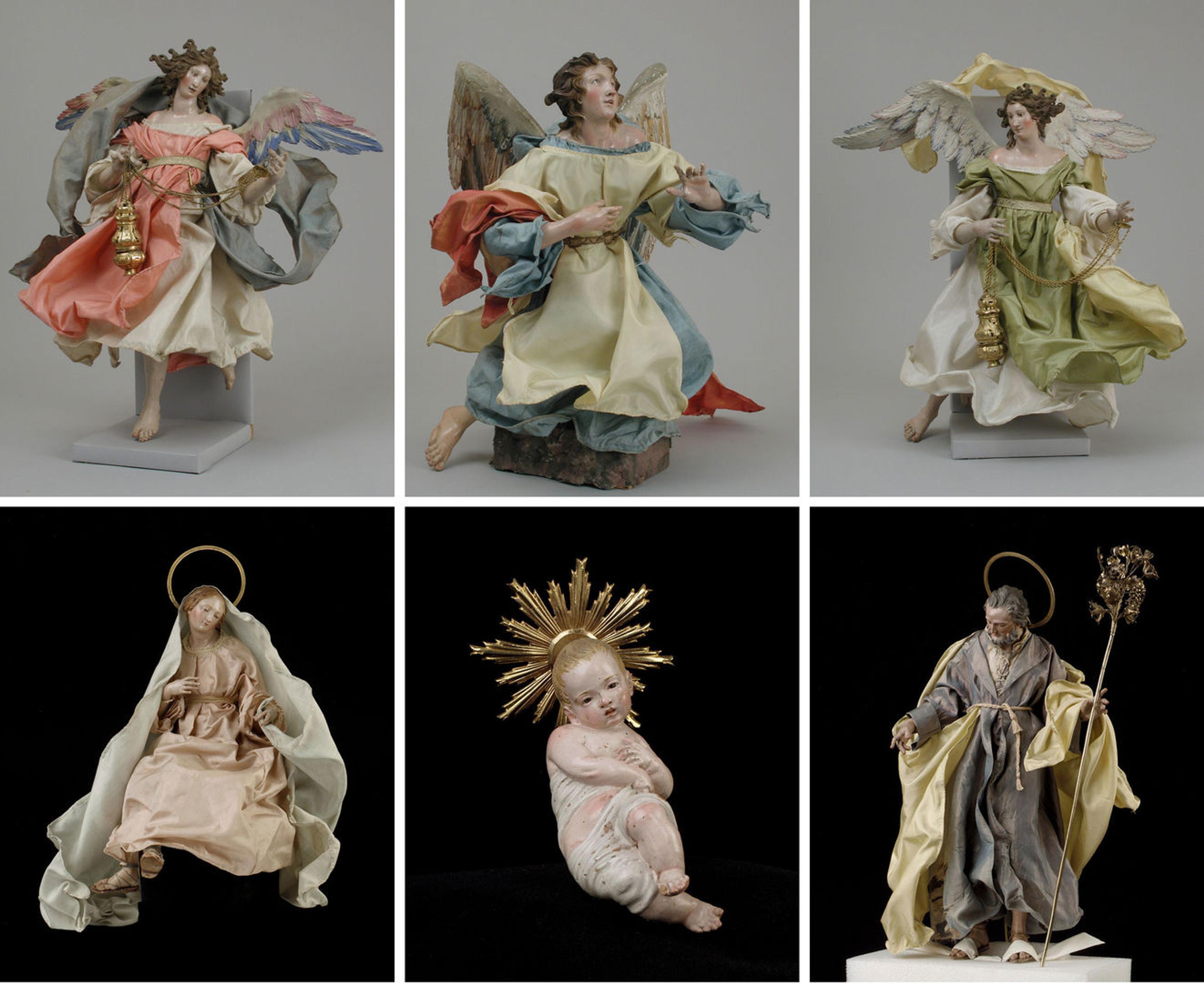 Assorted creche figures representing angels, the Virgin, Jesus, and Saint Joseph