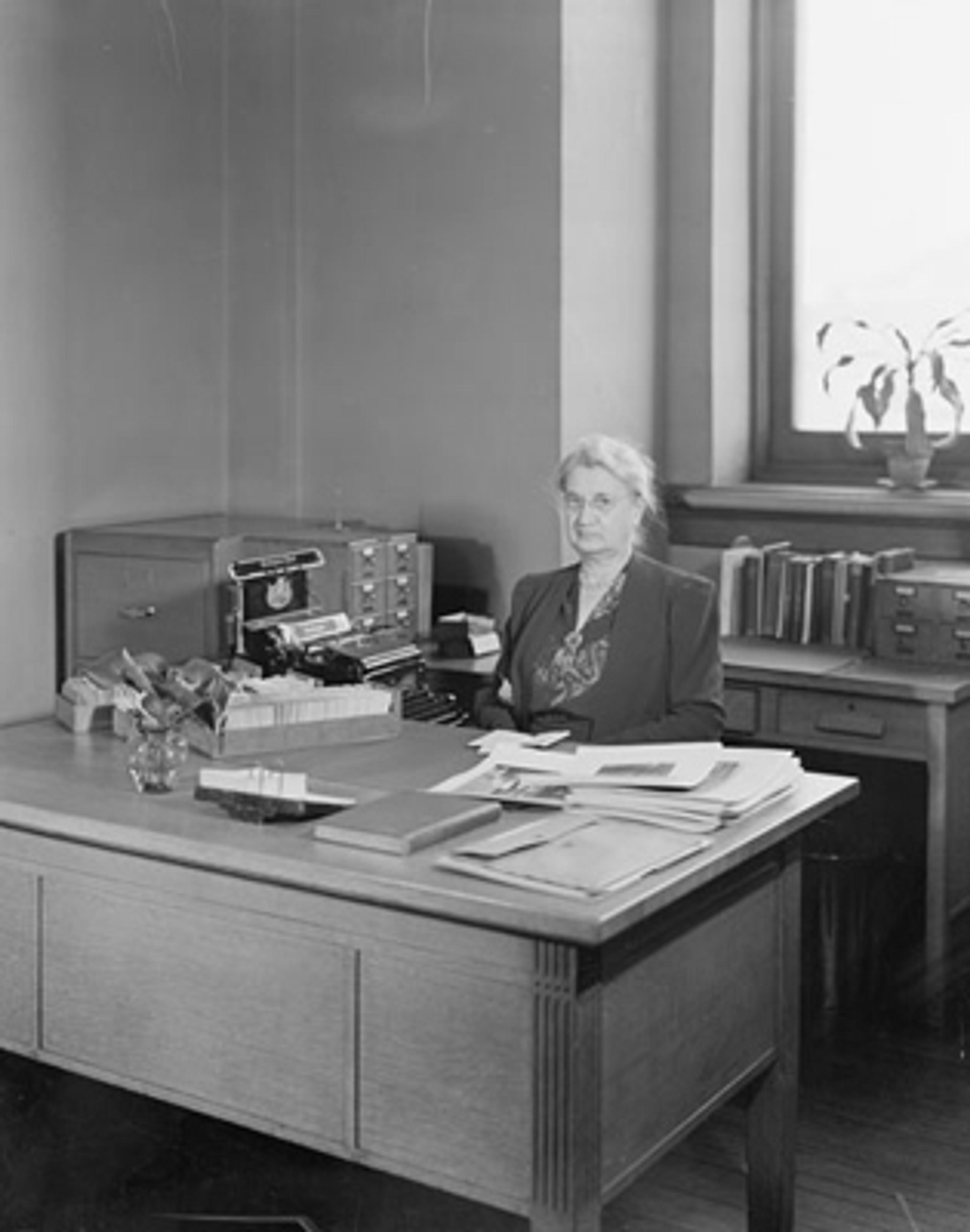 The Metropolitan Museum of Art, Catalogue Division; View of Margaret A. Gash, supervisor, seated at her desk. Photographed January 21, 1941