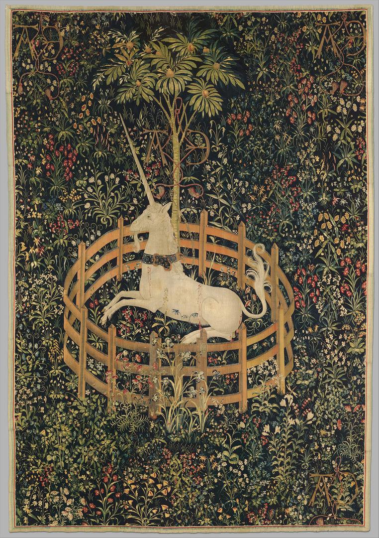 Woven tapestry of a unicorn in a garden surrounded by a fence