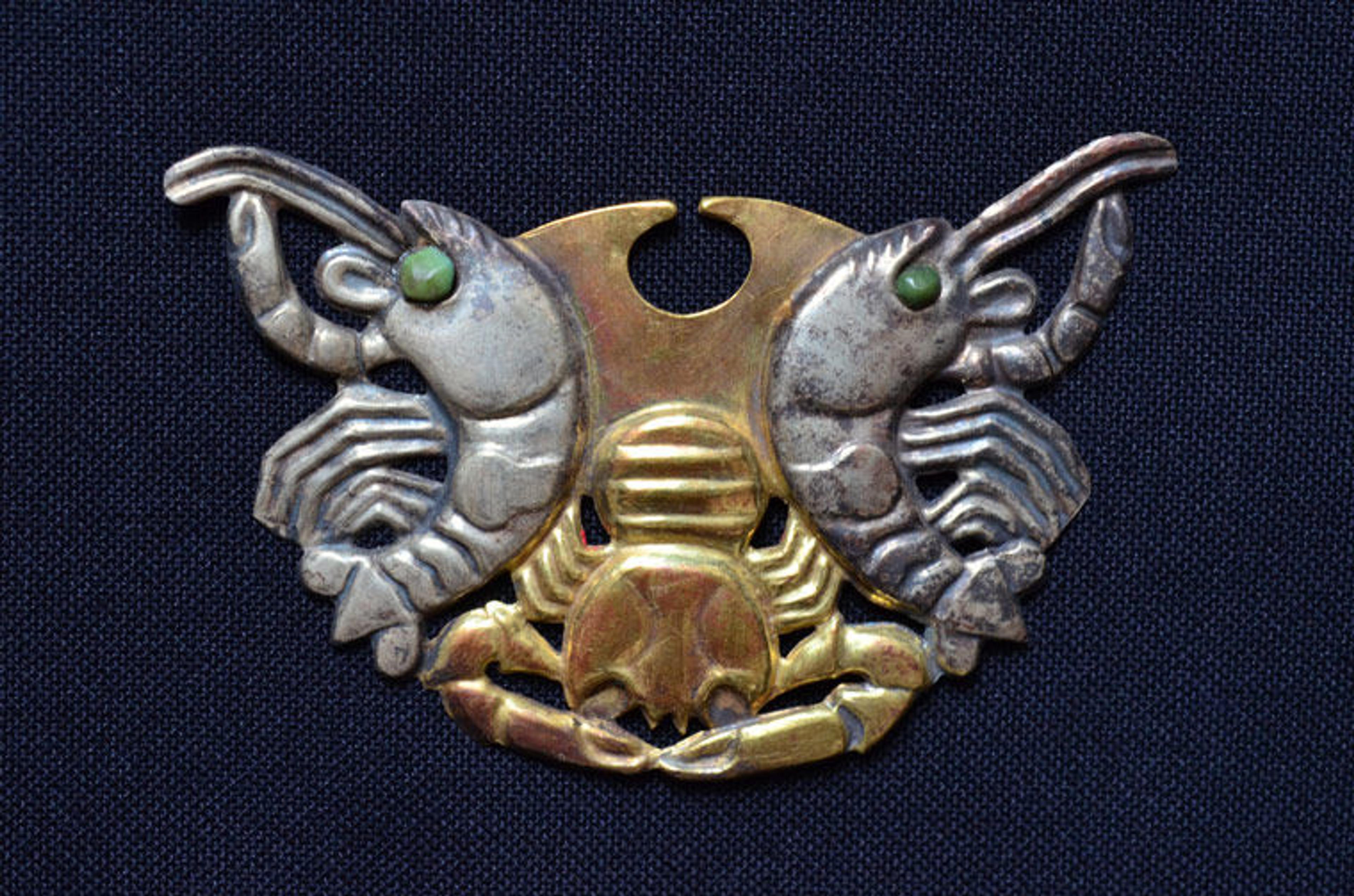 A nose ornament from fifth-century Peru in the shape of two crustaceans 