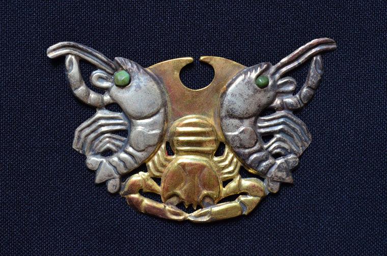 A nose ornament from fifth-century Peru in the shape of two crustaceans