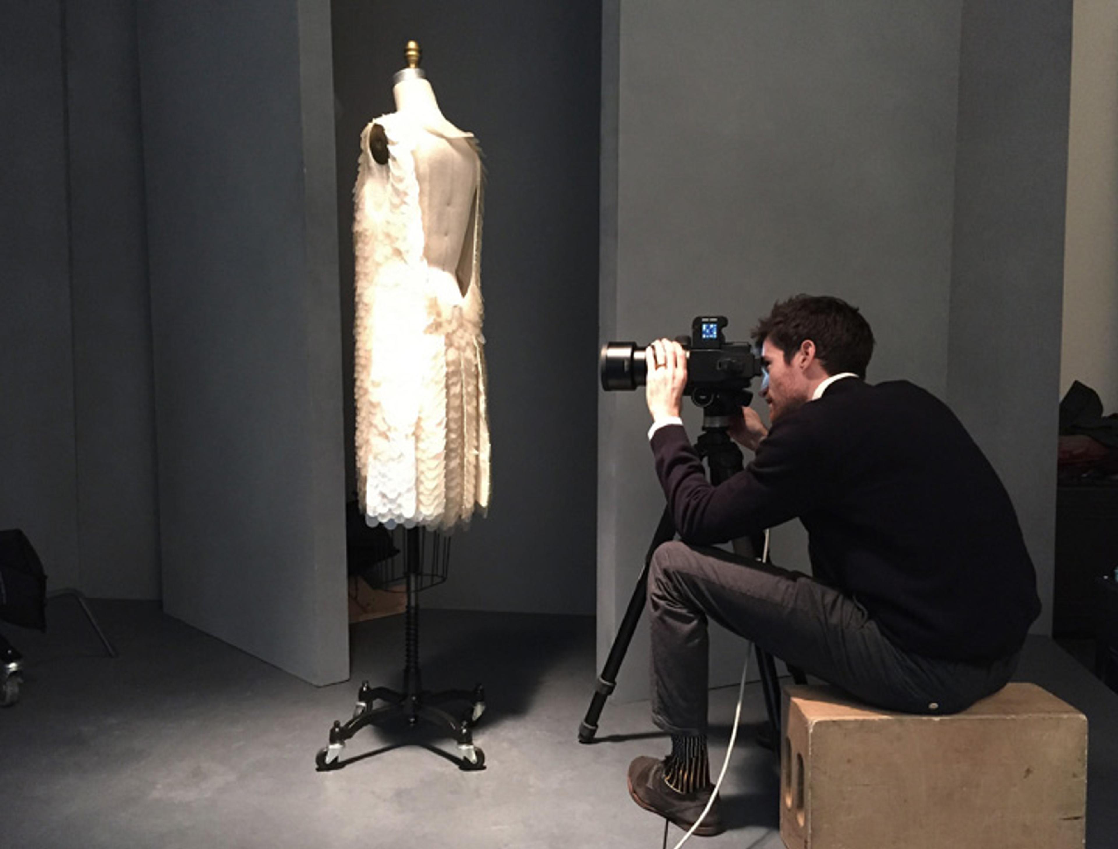 Nicholas Cope photographing a dress
