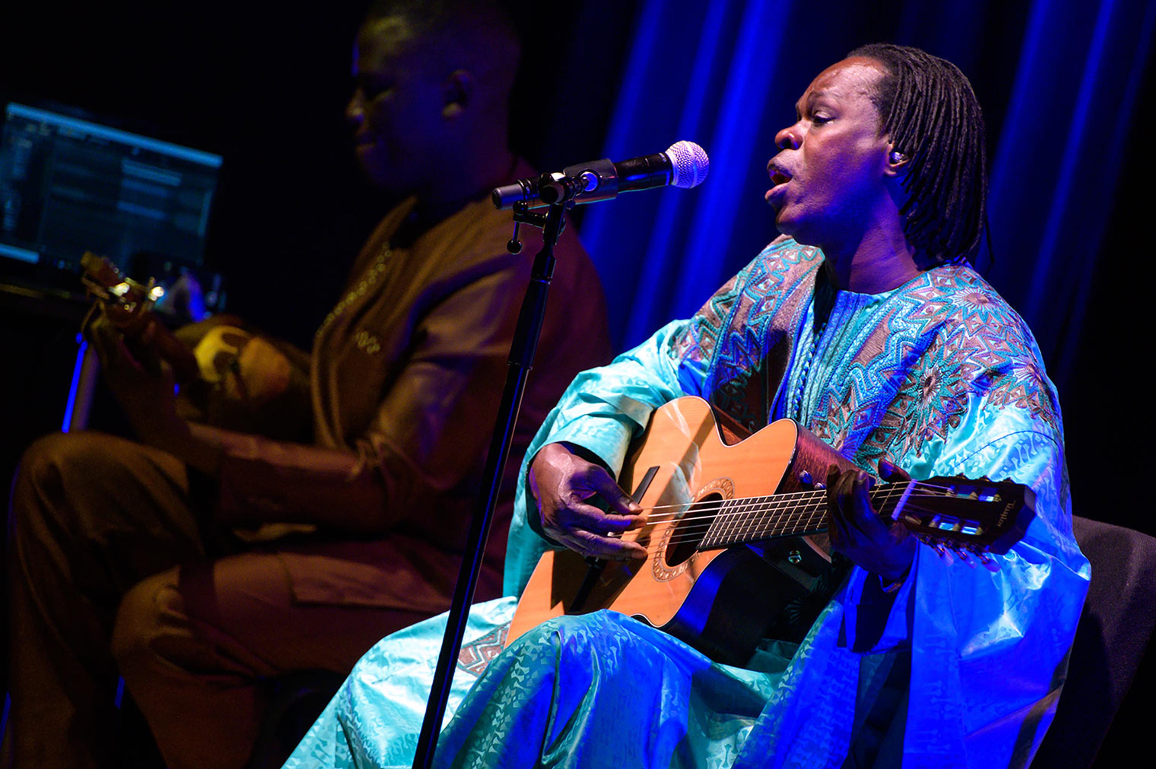 Senegalese singer Baaba Maal, in blue, performs an acoustic concert with Cheikh Ndiaye (left) at The Met.