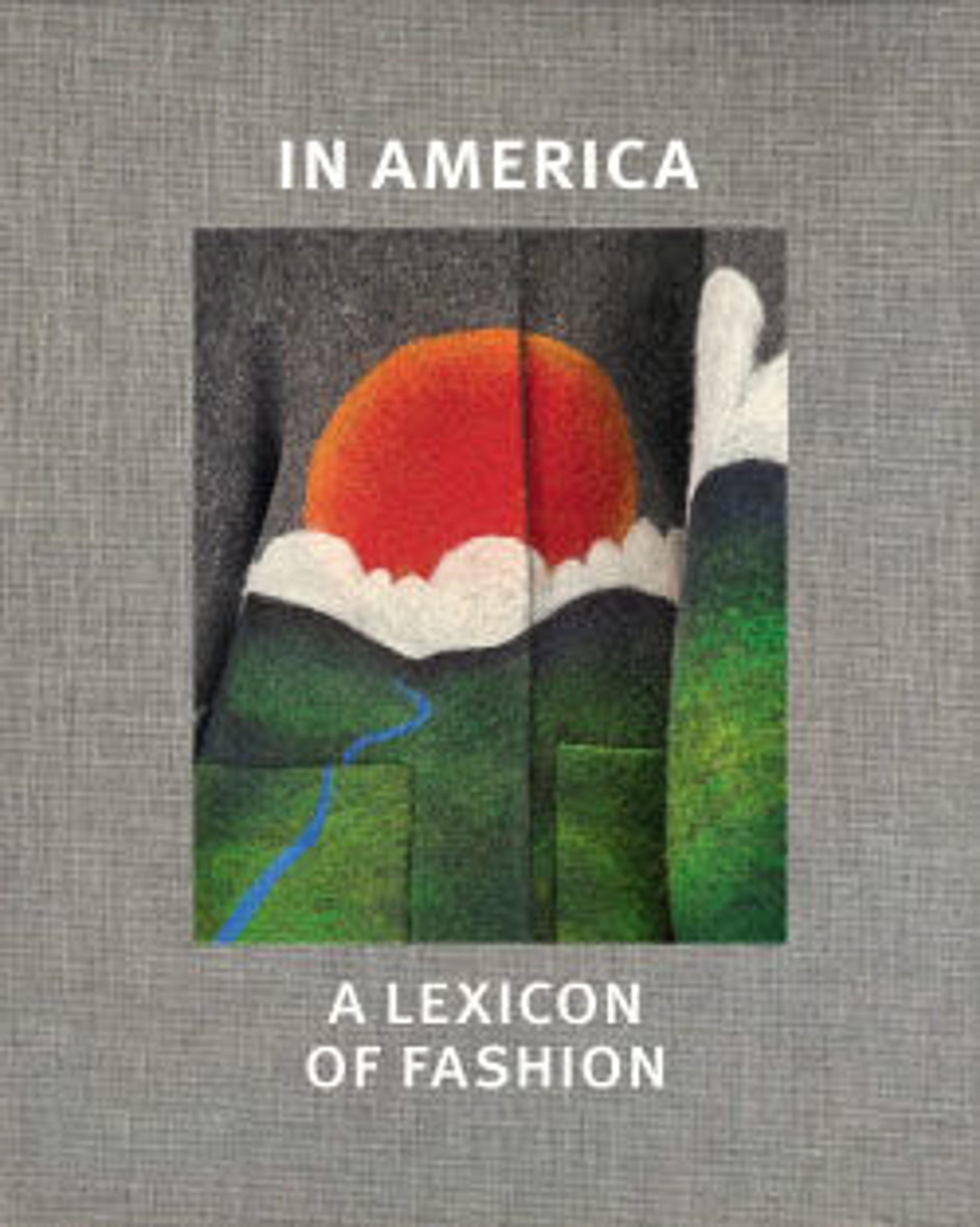 A clothing design of a sun behind clouds and a green landscape appears on a fabric garment surrounded by a fabric book cover with the title of the publication.