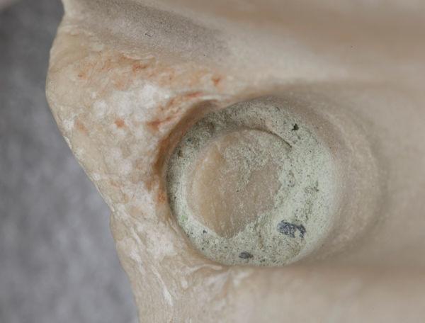 Fig. 3. Close-up photograph of the protruding stump of the broken tubular drill core, surrounded and partly covered by the granular material that provided the sample for analysis.