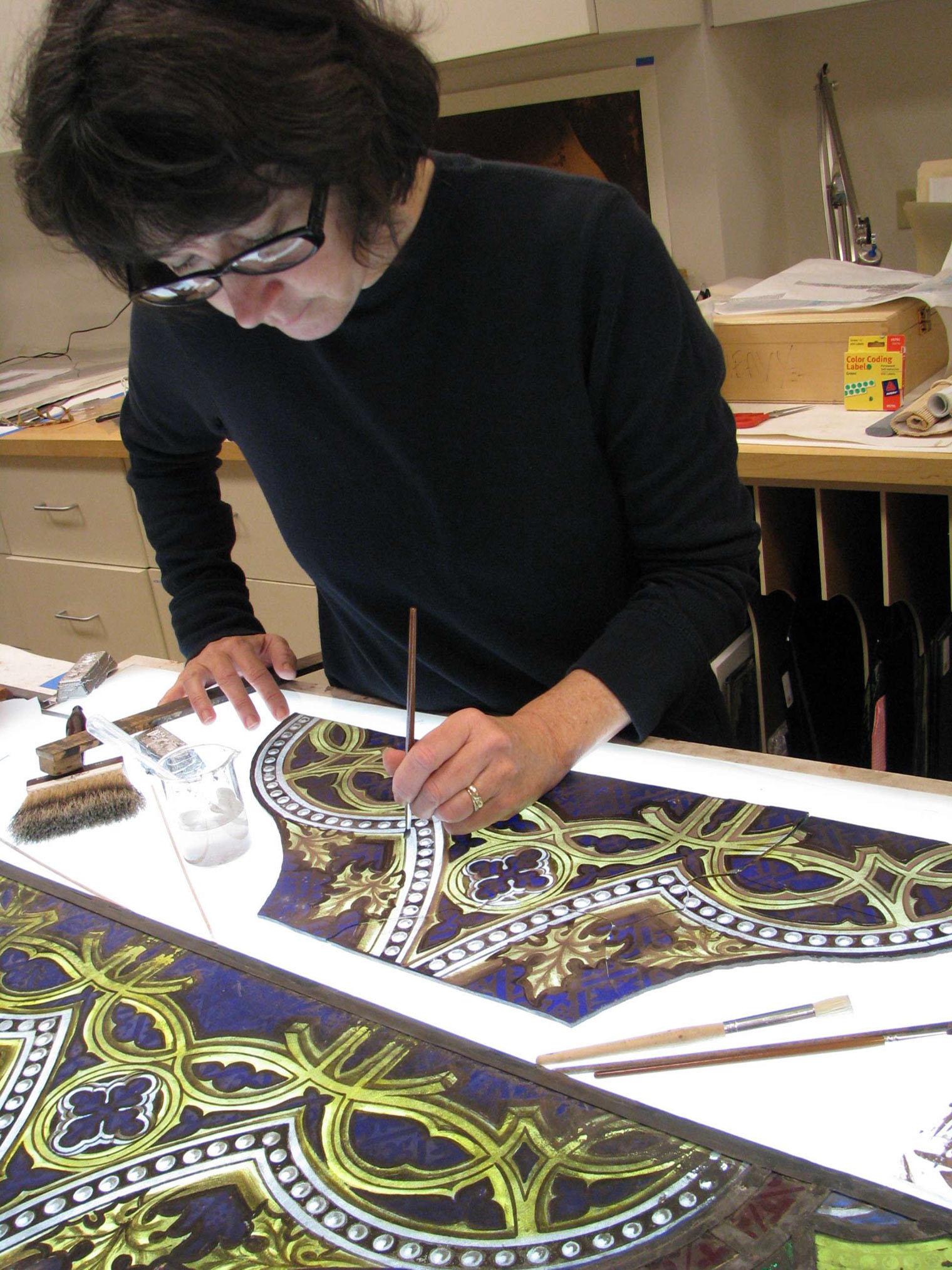 Janis Mandrus painting the replacement for the "Hope" header based on the original "Faith" header