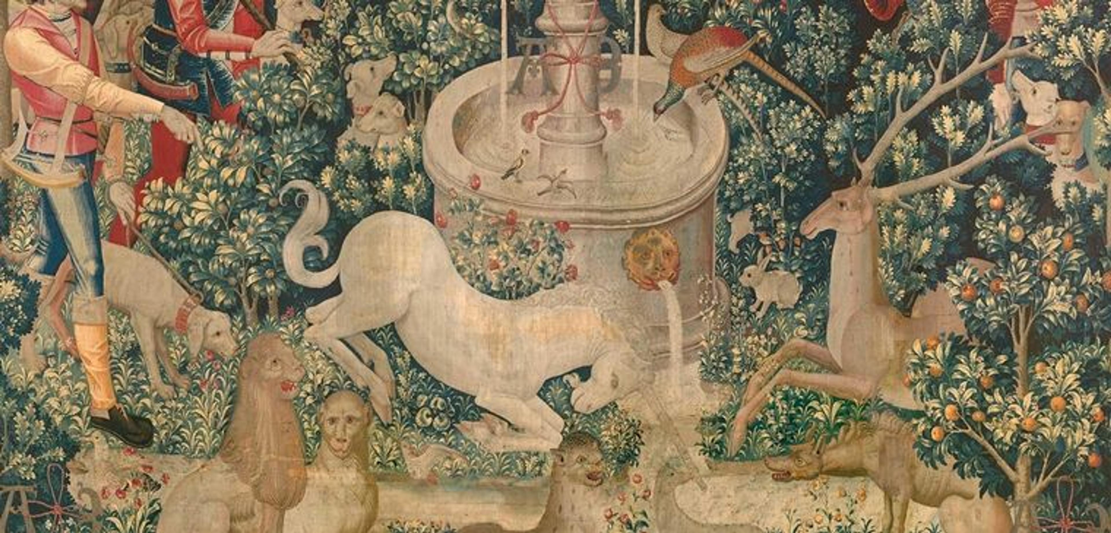 A woven medieval image of a unicorn dipping its horn in a stream, surrounded by various dogs, monkeys, birds, and humans.