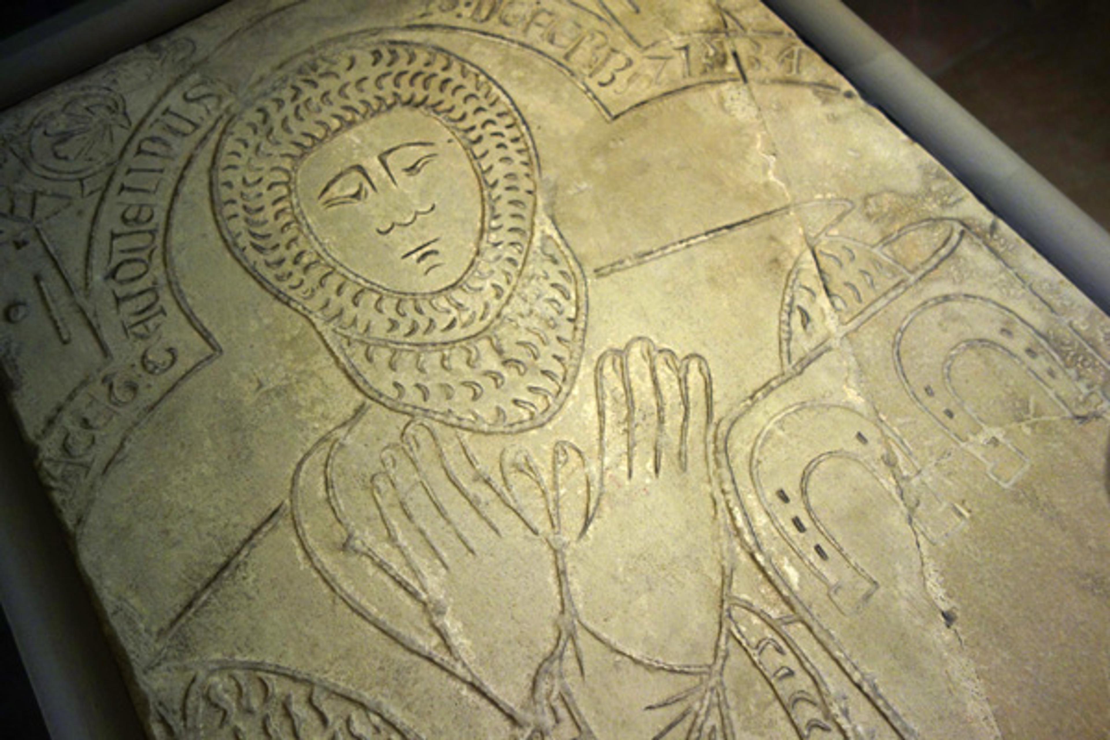 Tomb Effigy of Jacquelin de Ferrière. Note the three horseshoes (fers de cheval) at the chief (top) of the knight's shield