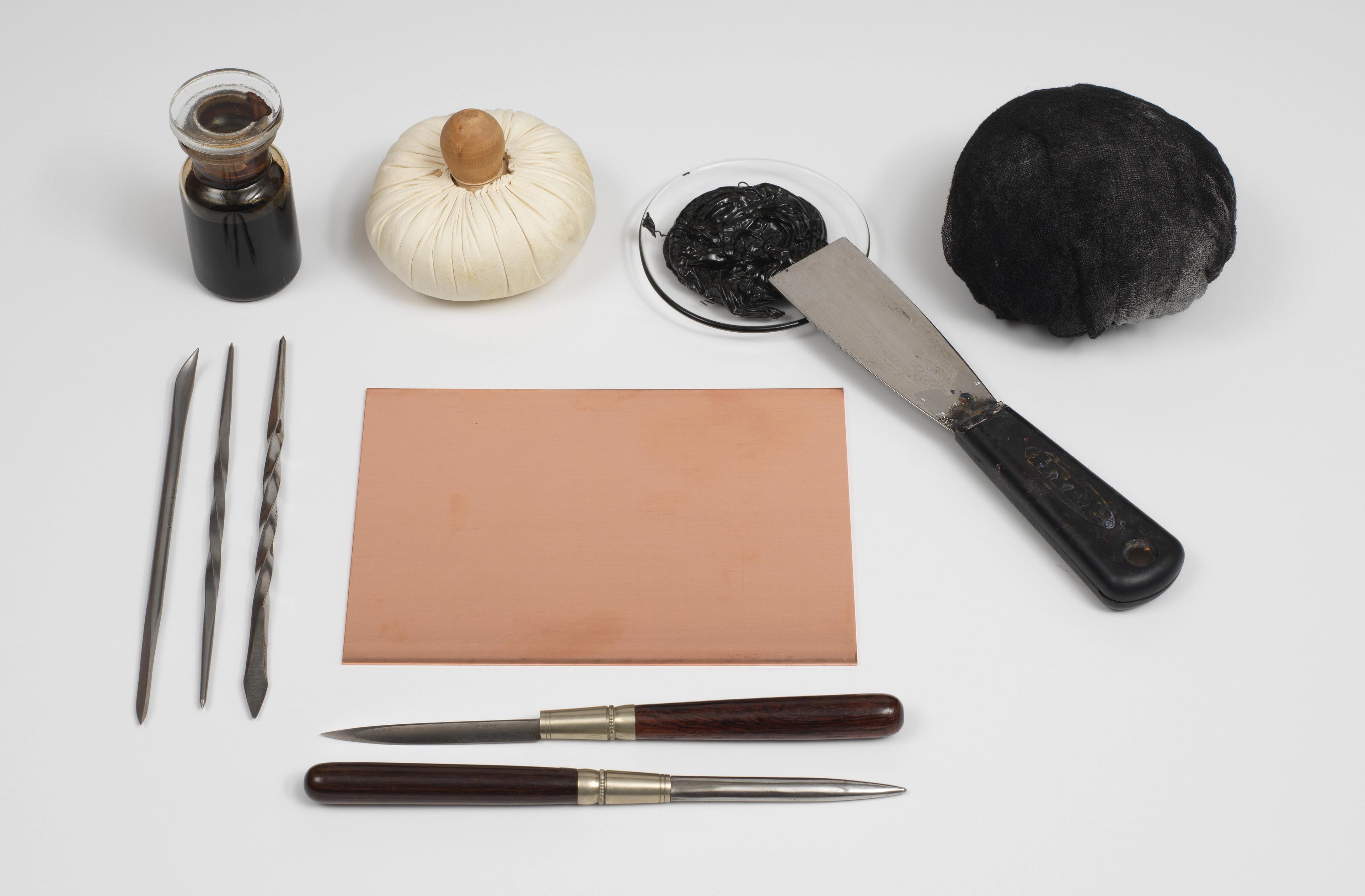 An assortment of etching tools artfully displayed on a table.