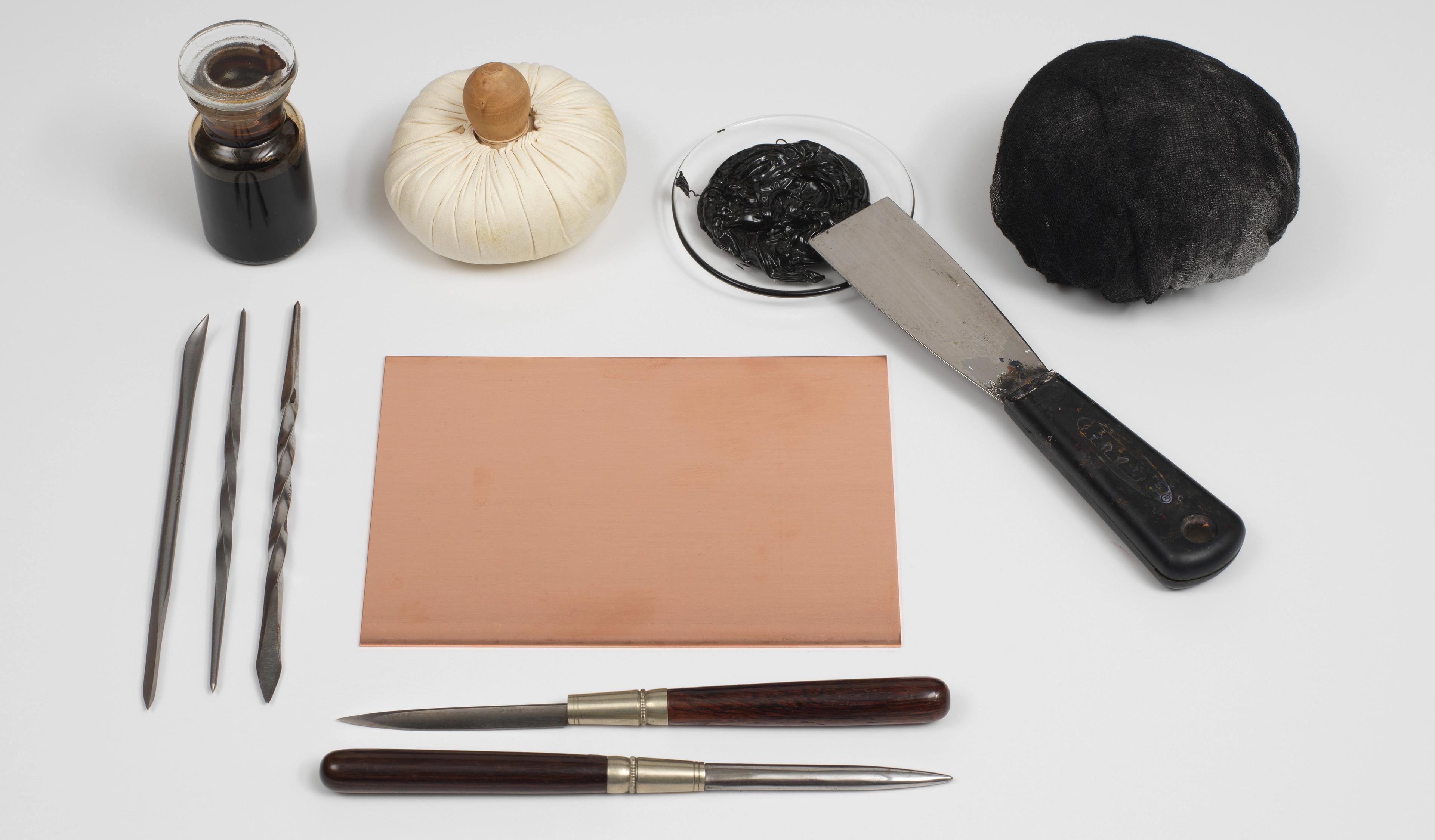An assortment of engraving tools artfully displayed on a table.