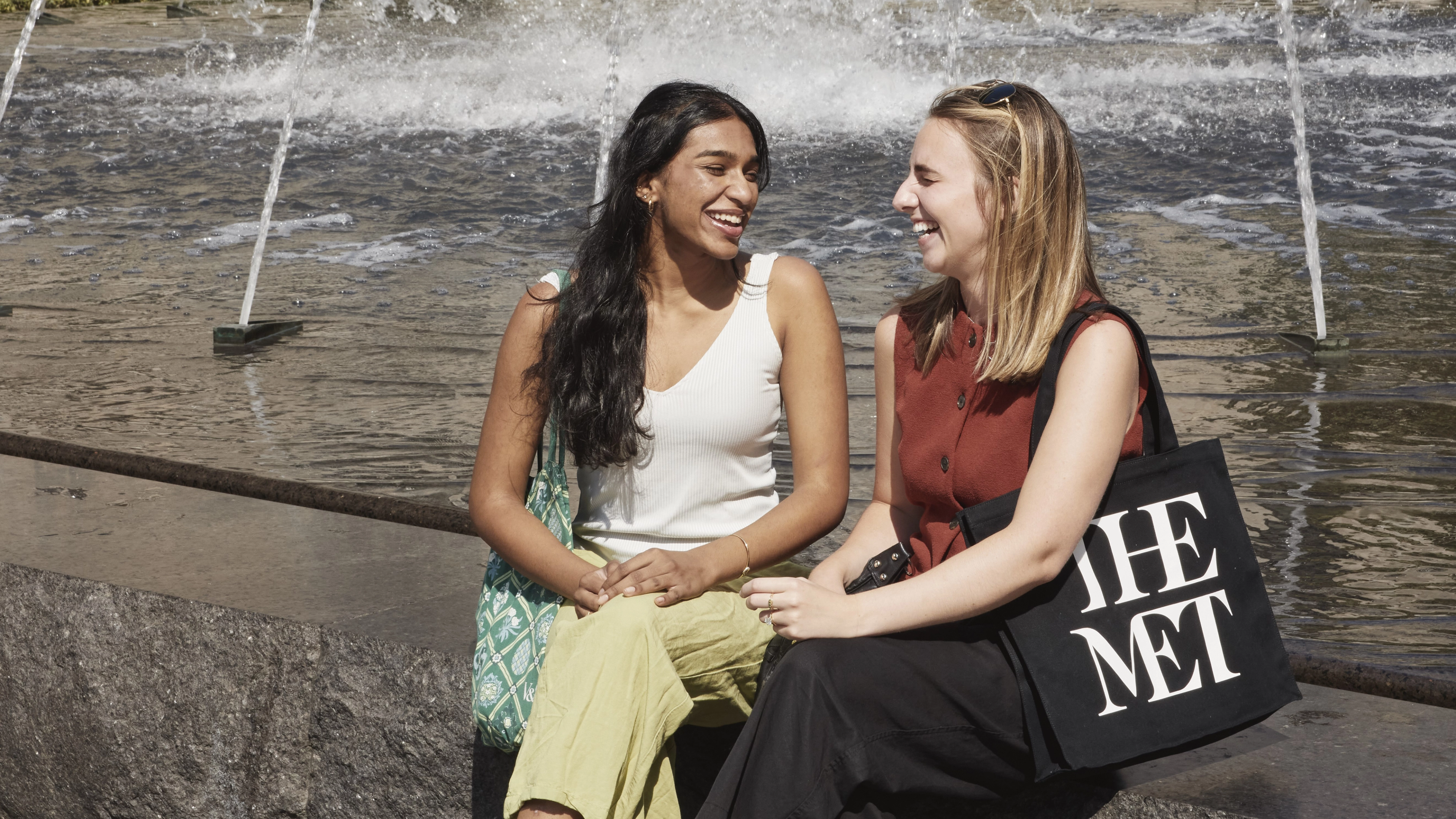 Two women smiling outside of the Museum. 