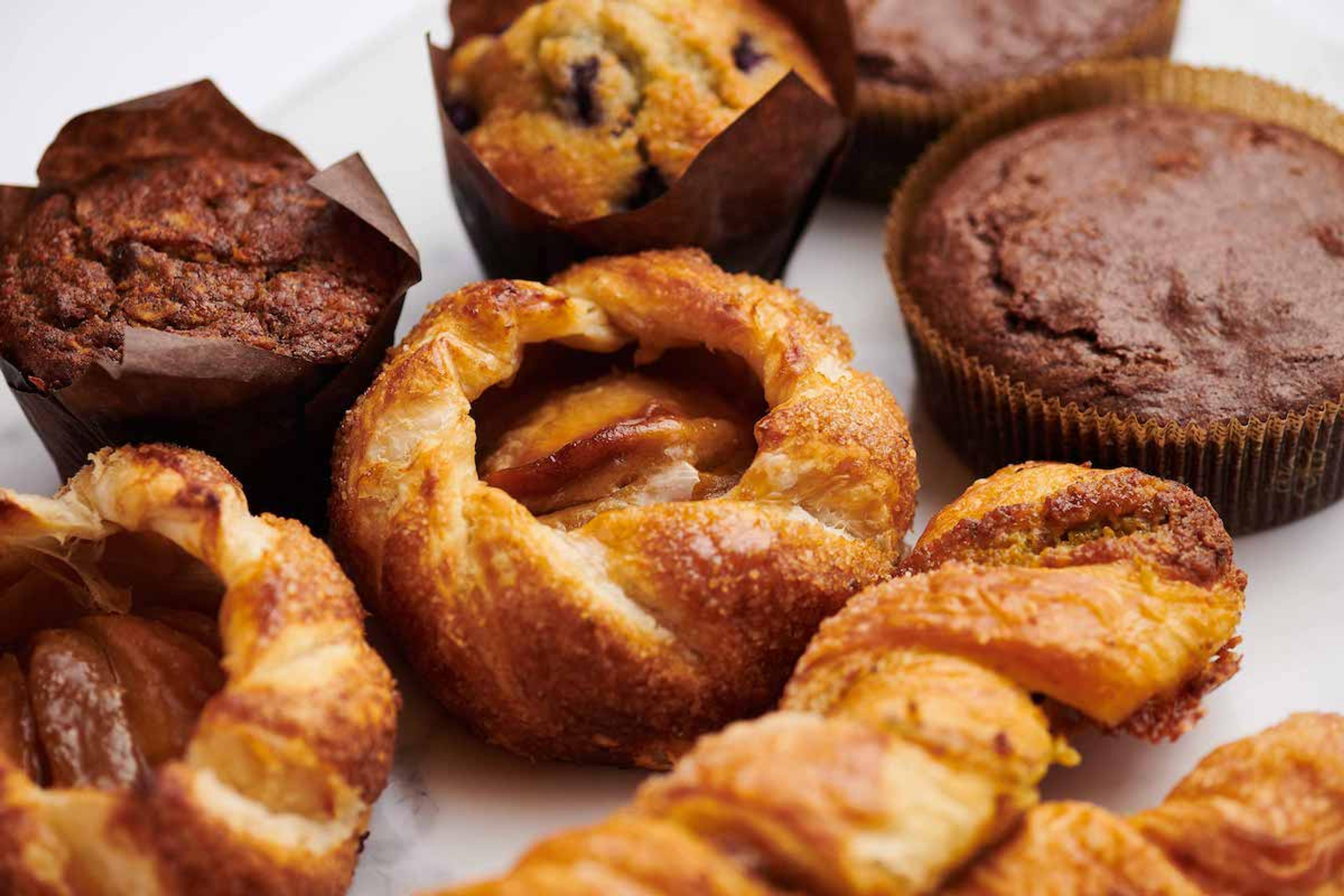 An assortment of pastries photographed against a white background.