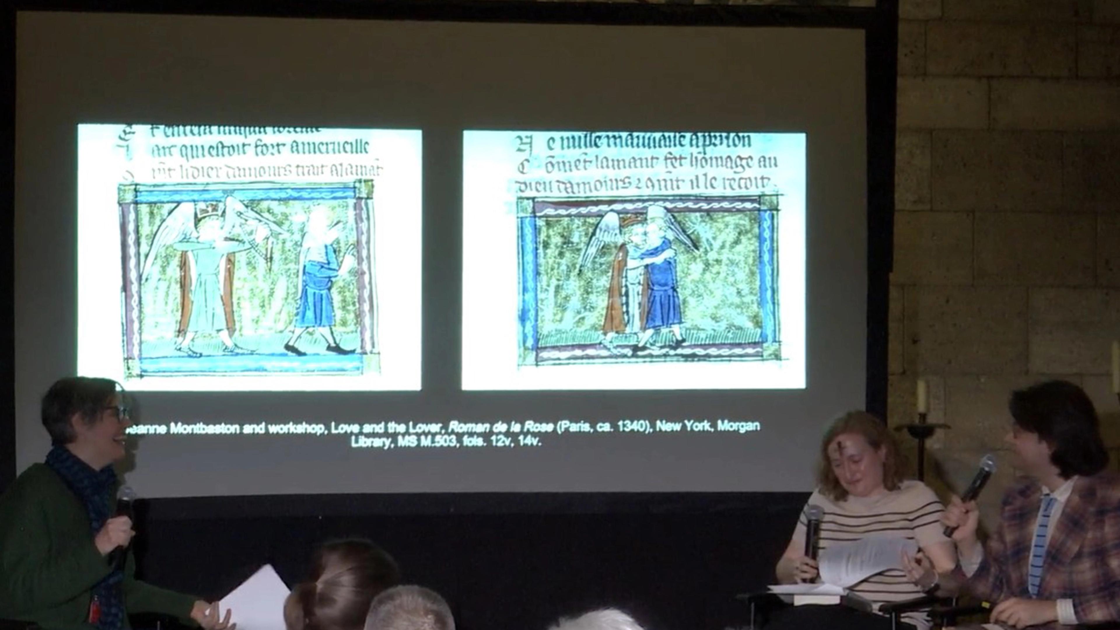 Three people holding microphones sit on either side of a projected screen showing two medieval images.