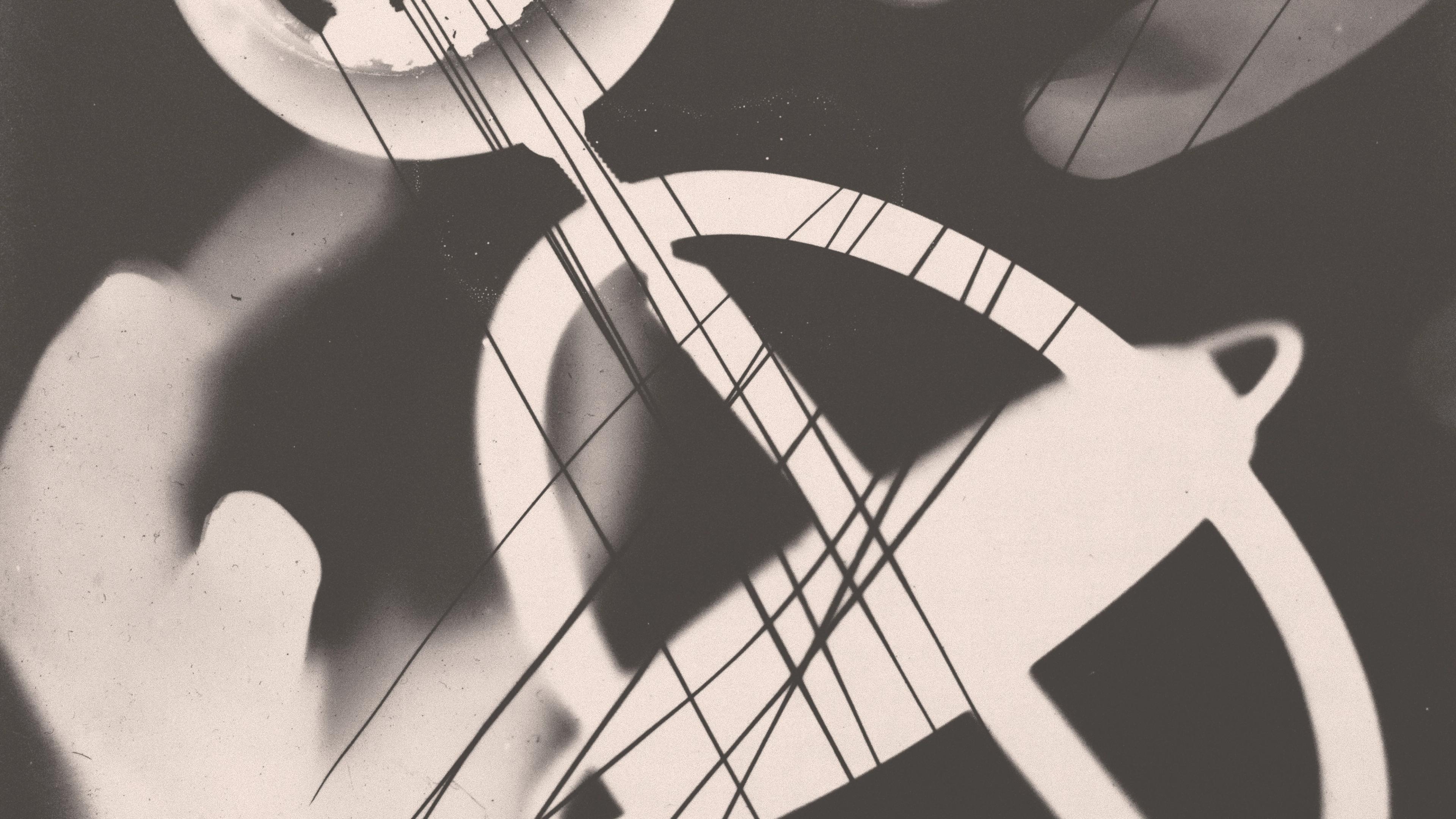 Abstract black-and-white photogram with cancellation marks.