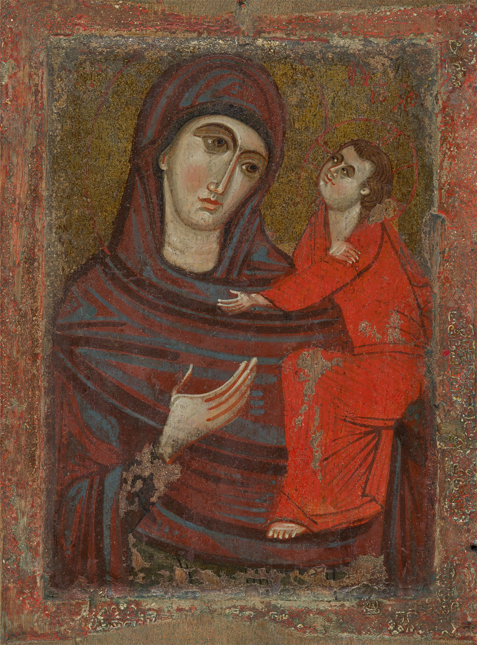 A byzantine painting of the virgin and child. On the left the virgin holds christ with her right hand outwards wearing a green-red rob that goes over her head. On the right is the child christ in a bright red robe.  