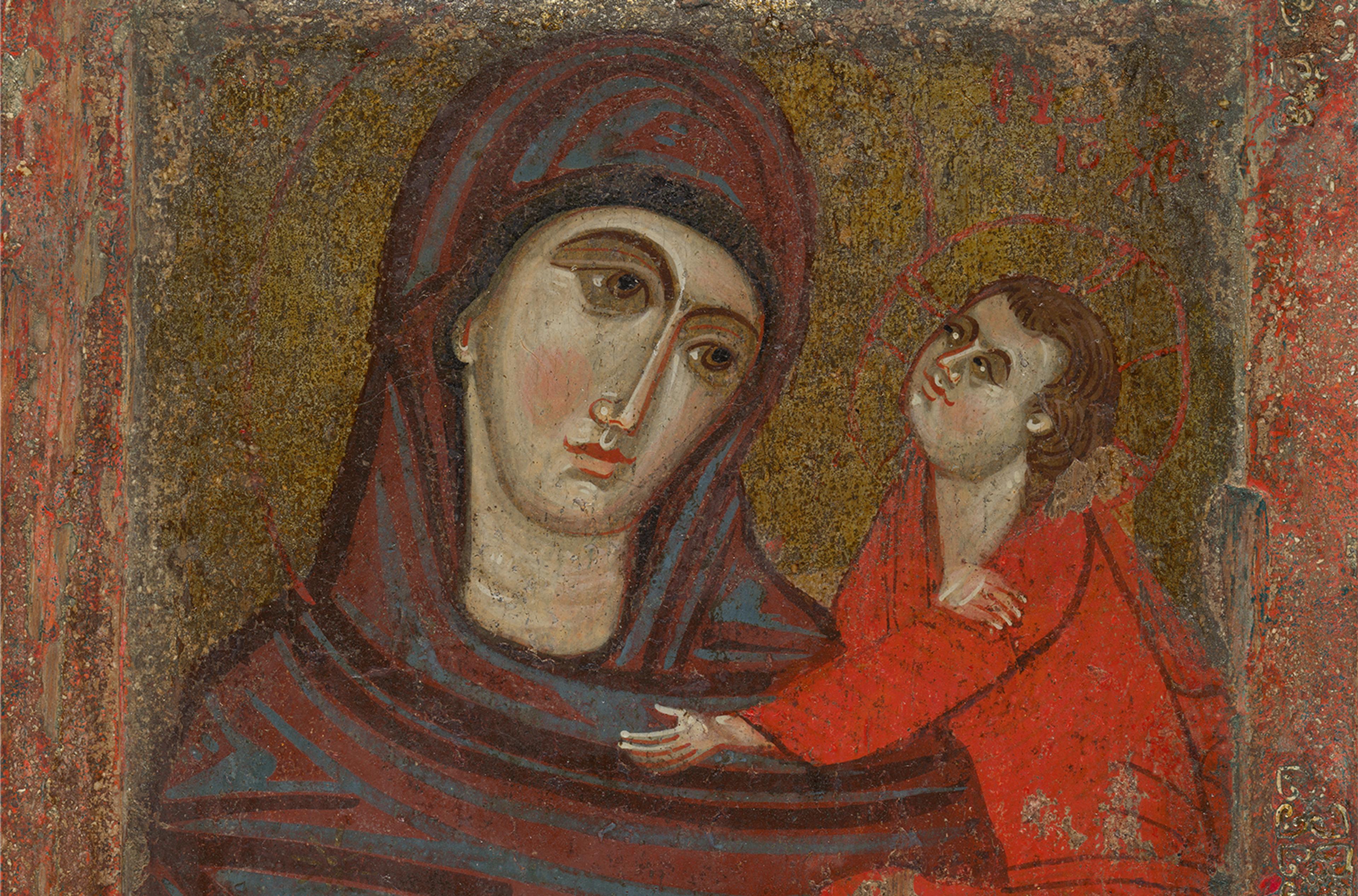 A byzantine painting of the virgin and child. On the left the virgin holds christ with her right hand outwards wearing a green-red rob that goes over her head. On the right is the child christ in a bright red robe.  