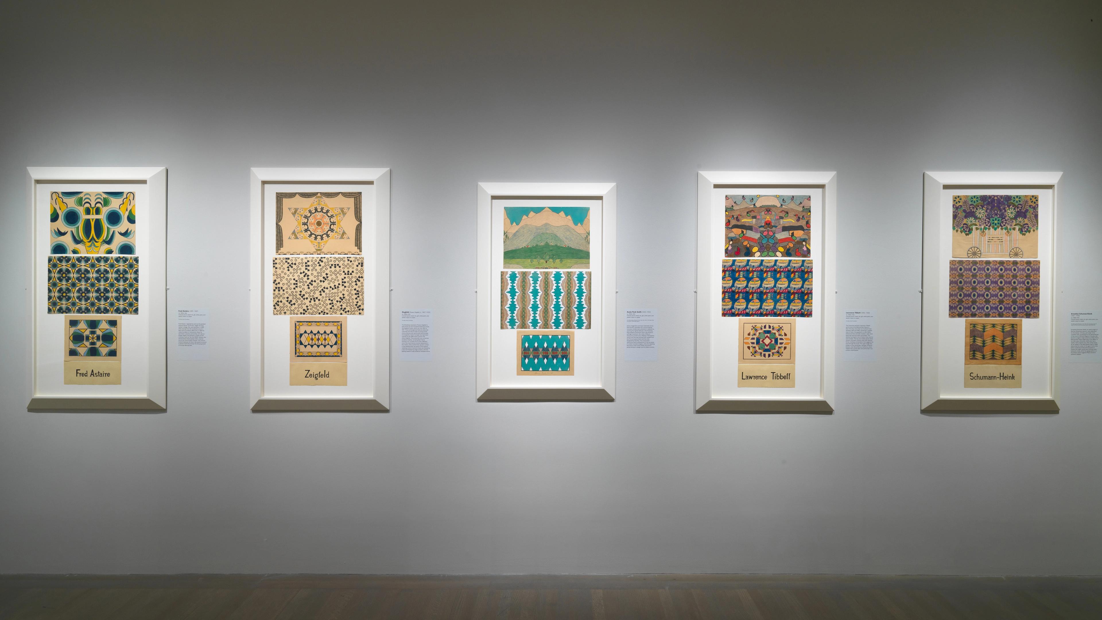 Gallery view from Mary Sully: Native Modern. Five drawings with vibrant colors and geometric patterns line a wall.