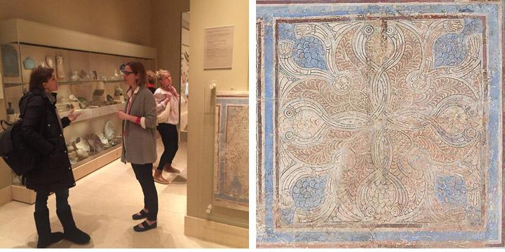 Curator discussing painted dado panel from Iran with visitor; image of painted panel