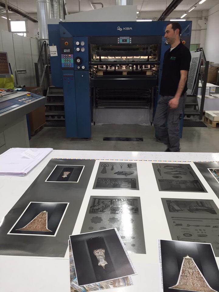 Printed pages lying on a table in a factory