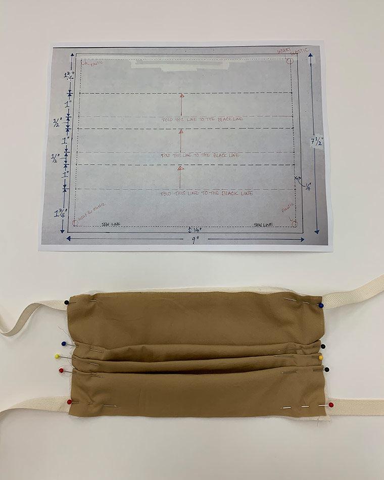 Fabric is folded into the shape of a surgical mask