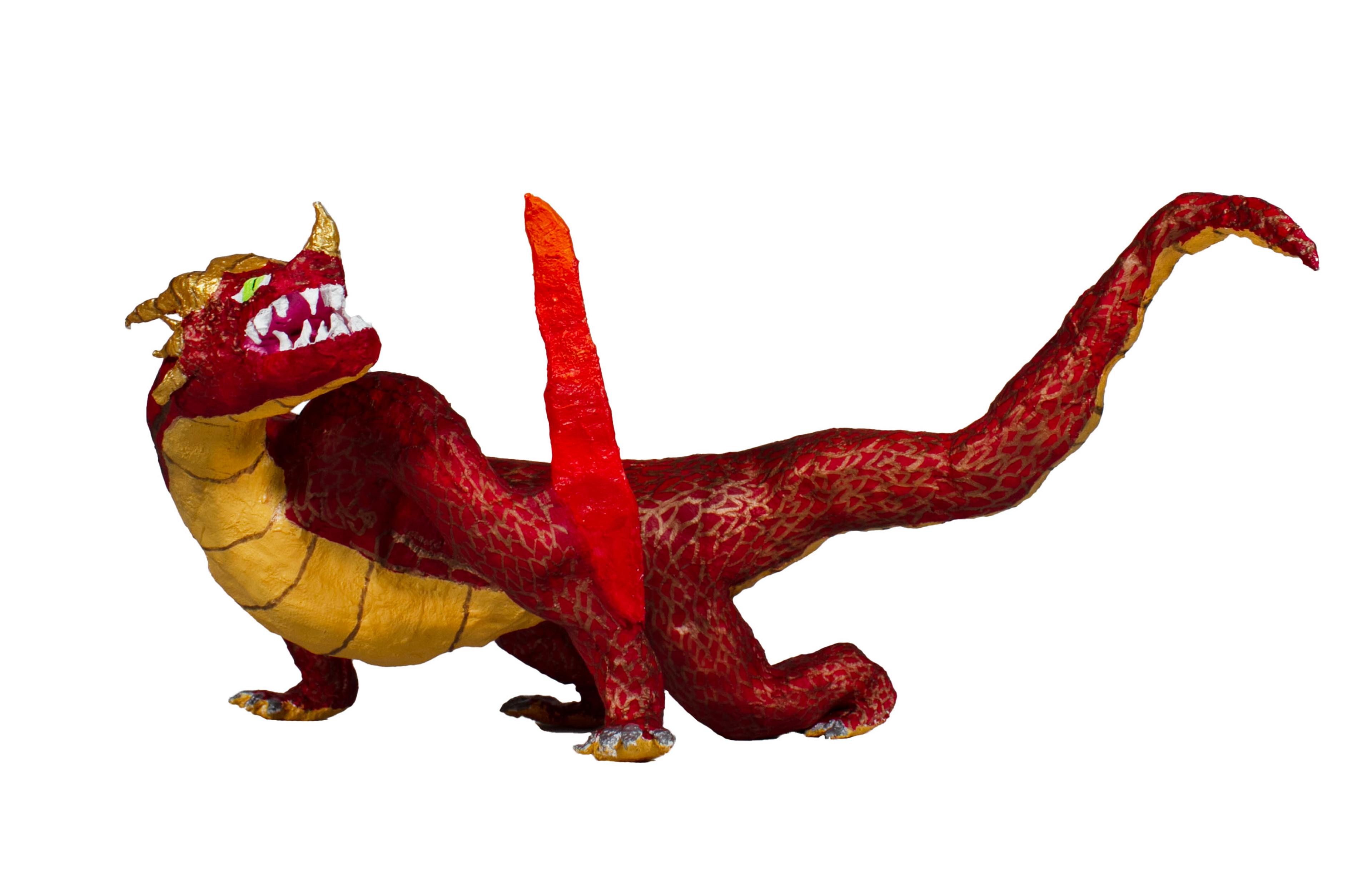 Sculpture of a red dragon made with plaster wrap, newspaper, and tape. The dragon is crouched on all fours, facing left, with its head turned back over its left shoulder, gazing upward and to the right. The dragon's underbelly is yellow with thin red stripes. The dragon's tail is long and tilts upward to the right. The dragon has golden yellow horns on its head and snout, and sharp white teeth in its open mouth. One of the dragon's wings hangs over its front left leg.