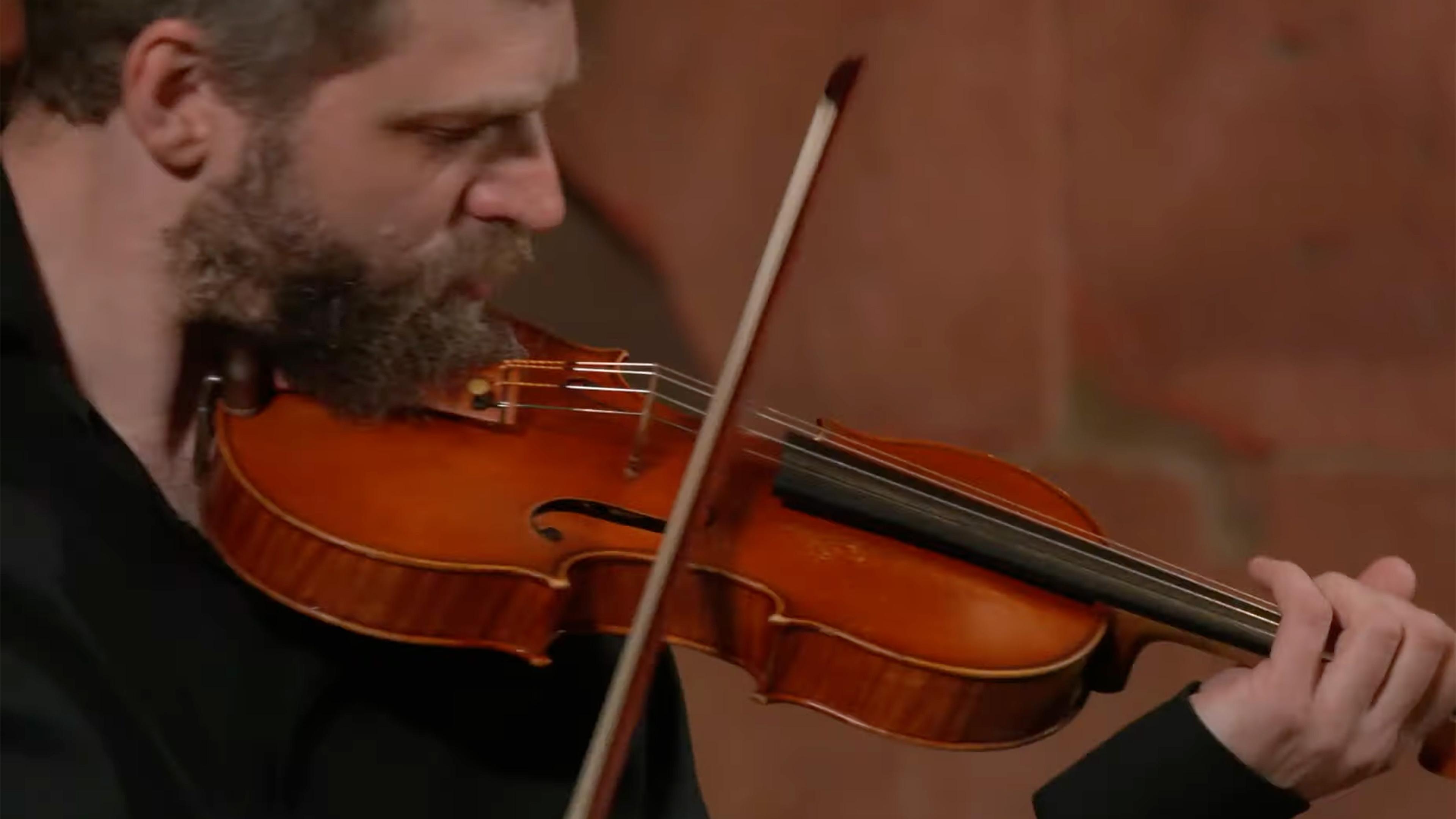 Close up of Johnny Gandelsman playing the violin