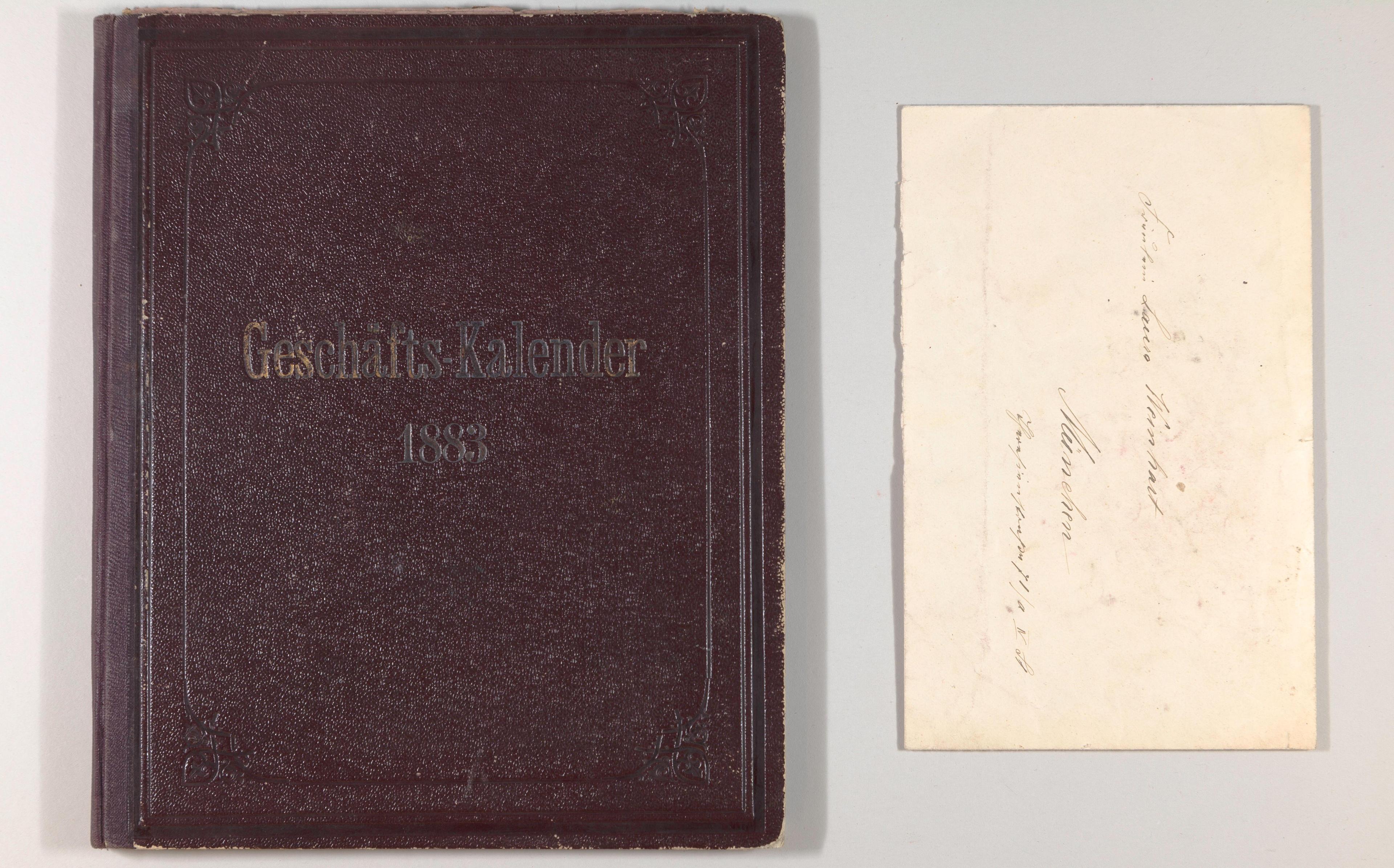 Brown leather cover next to envelope with handwriting