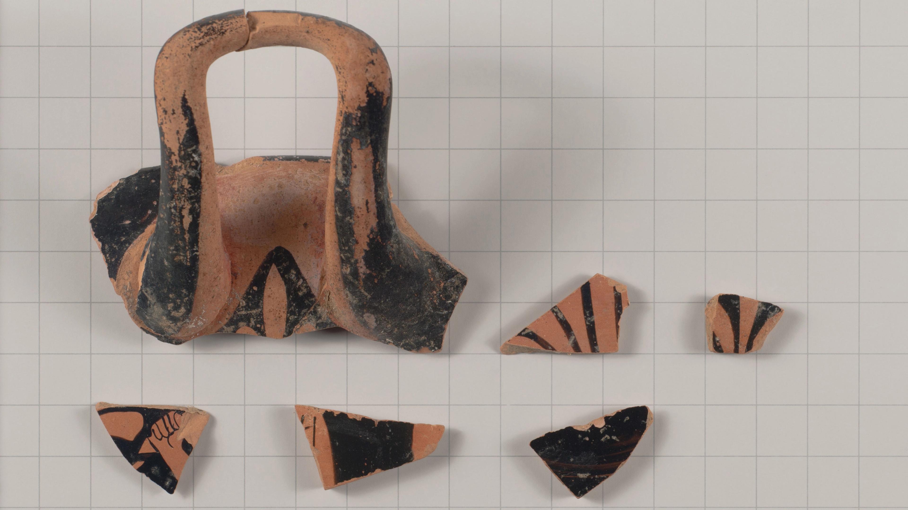 Fragments of a Greek terracotta drinking cup