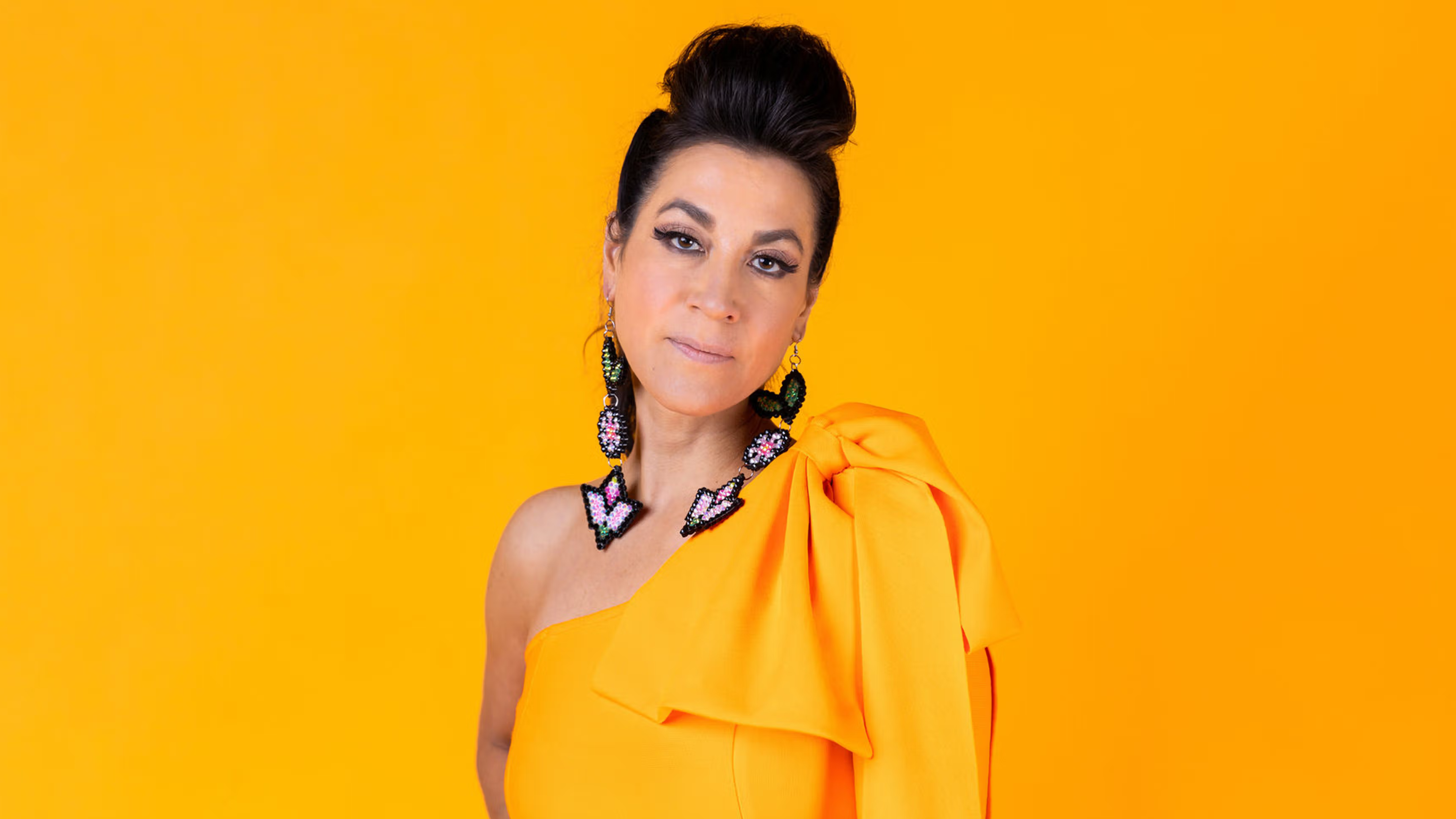 Headshot of Amber-Dawn Bear Robe, featuring earrings by Angela