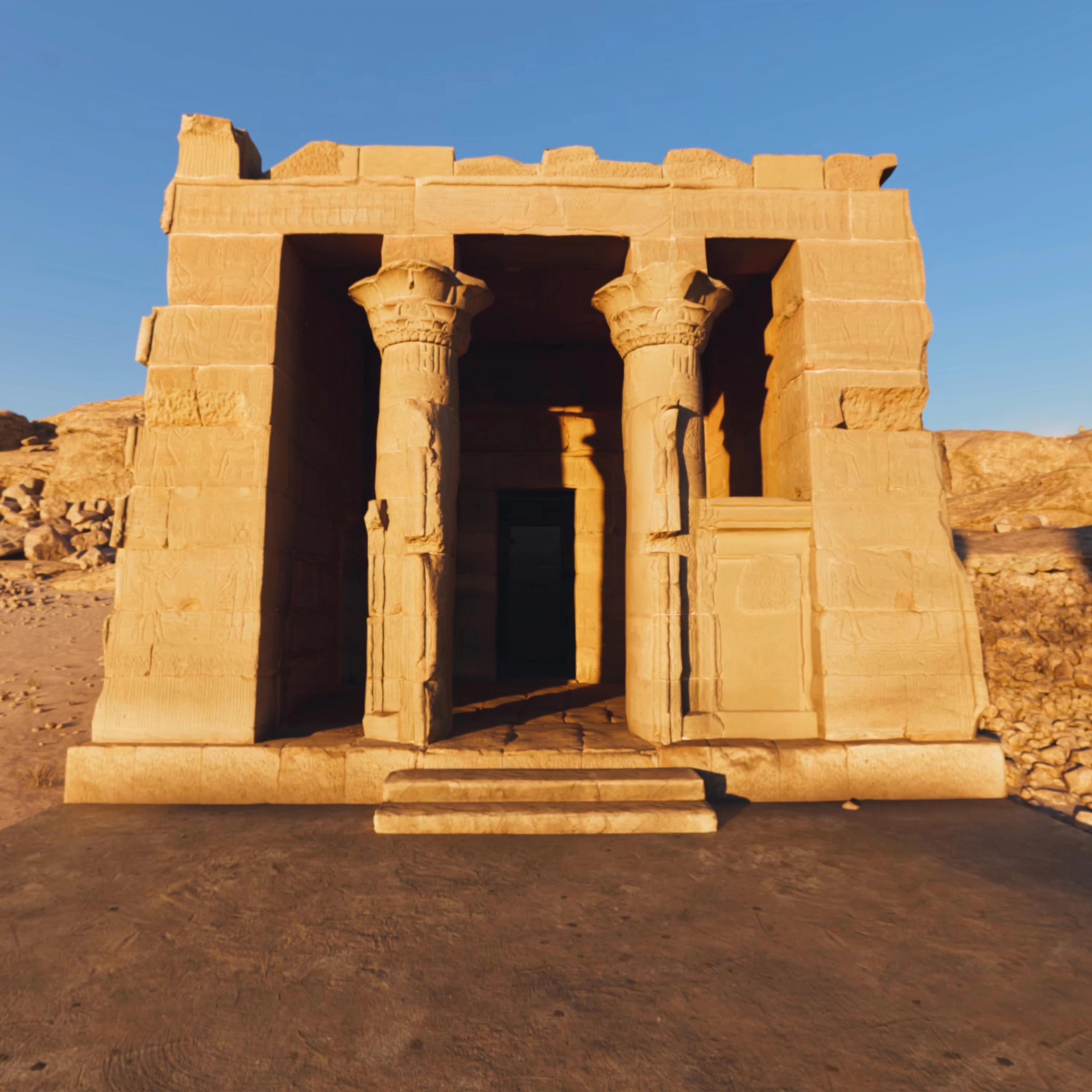 Stone temple with decorated columns in a rocky desert landscape.