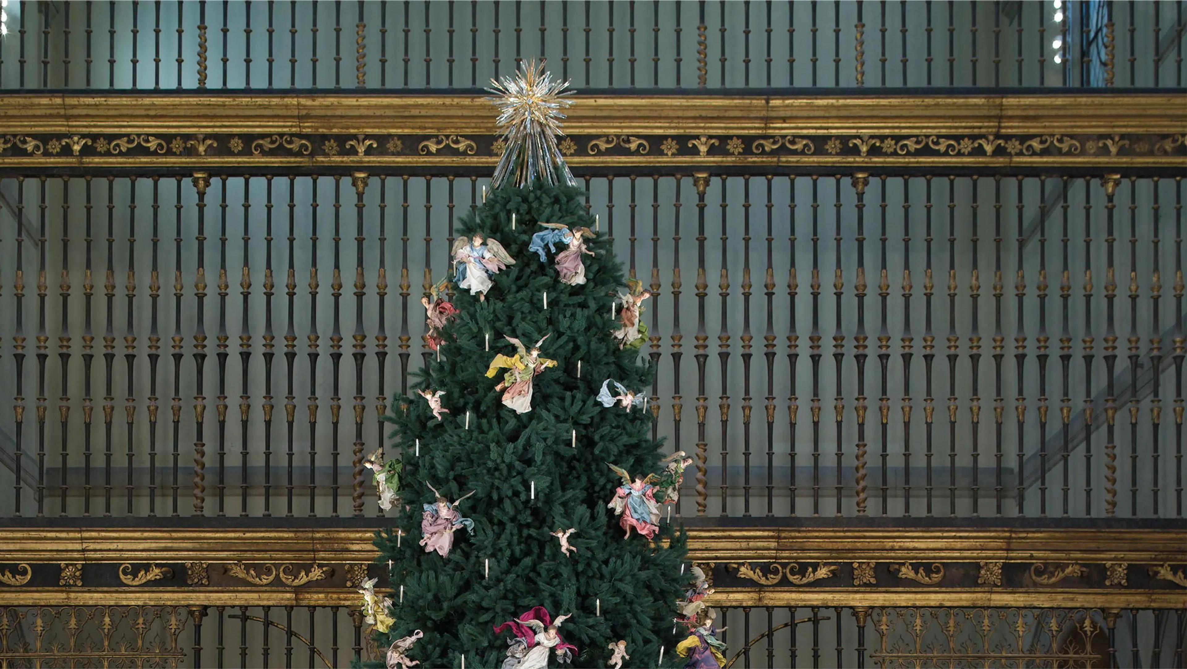 Christmas Tree standing tall with holiday ornaments.