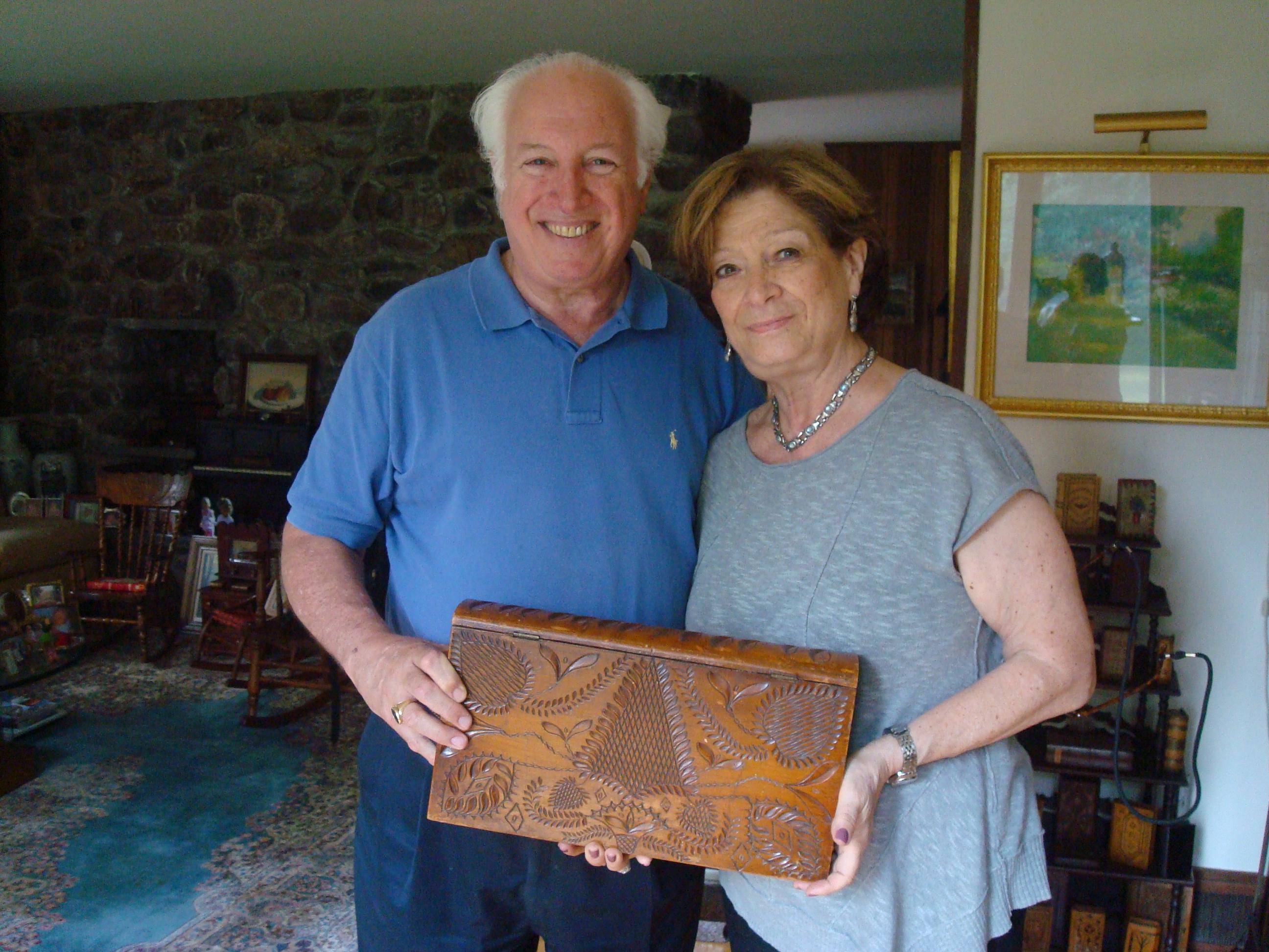 Portrait of the couple holding a blook