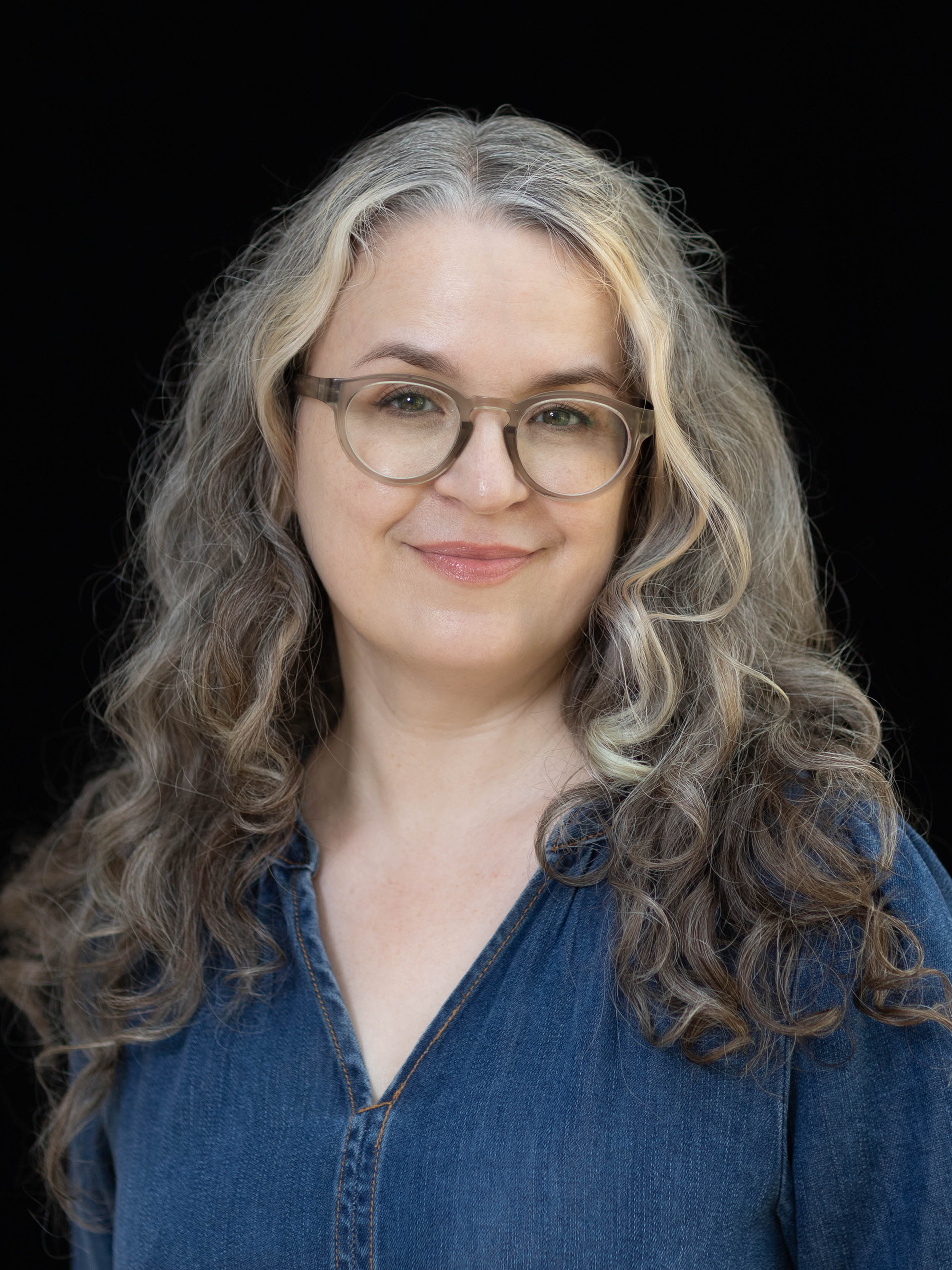 Headshot of Christina Amato against a solid black background