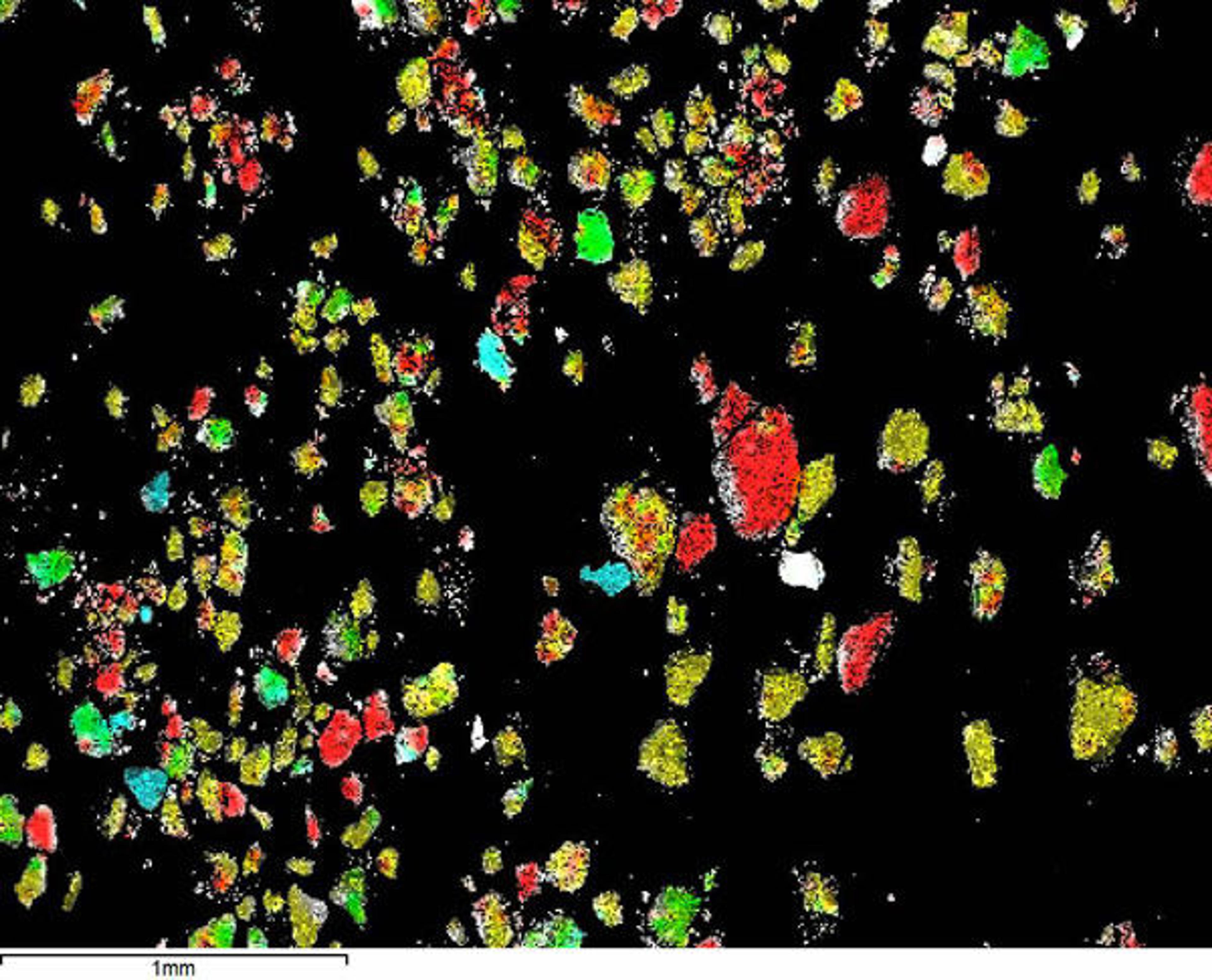 Fig. 5. An X-ray elemental map showing the distribution of aluminum (Al, yellow), silicon (Si, blue), and calcium (Ca, red) in the abrasive sample. The yellow particles are corundum fragments.