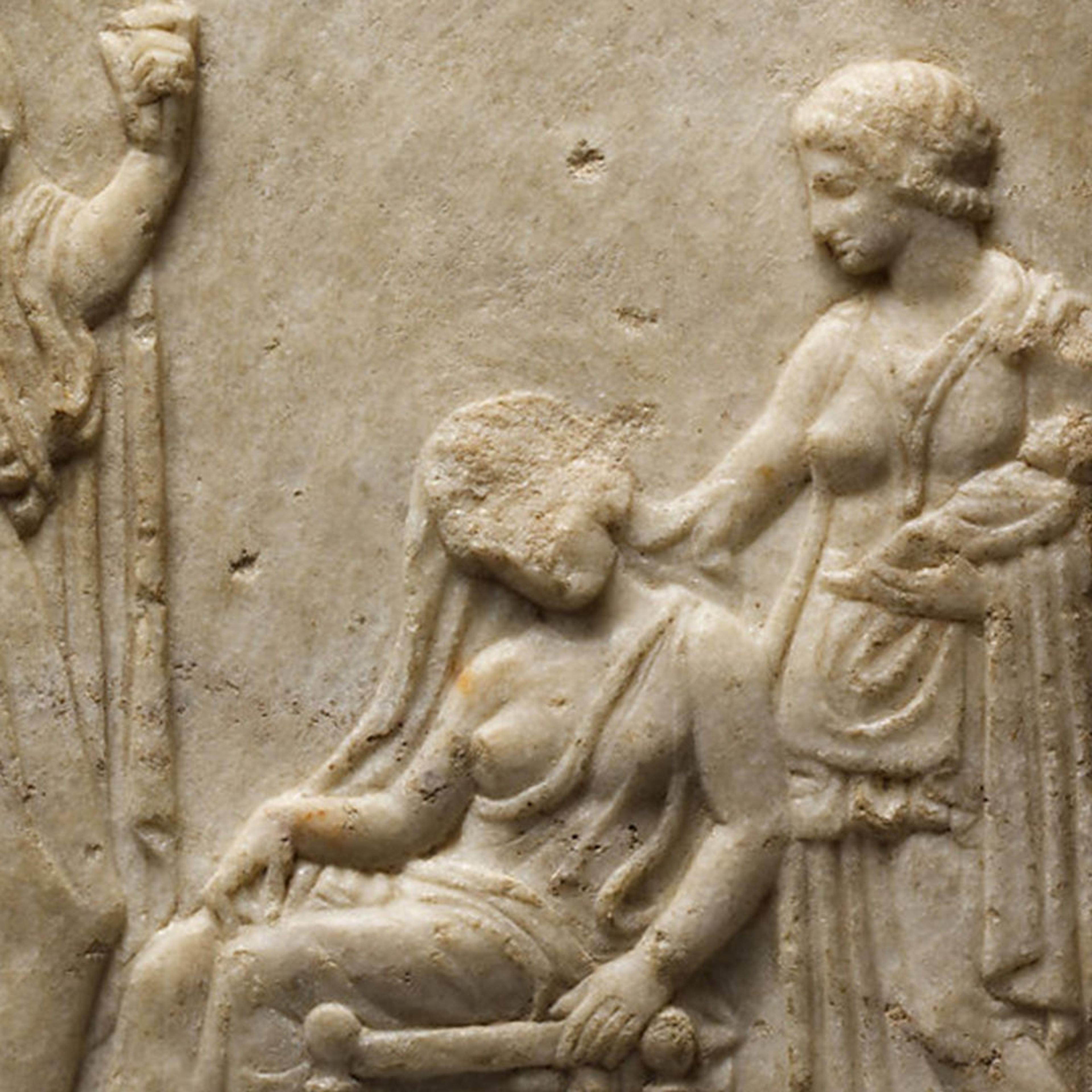 Detail of a woman holding a baby in her arms while resting her elbow against a sitting woman who appears exhausted