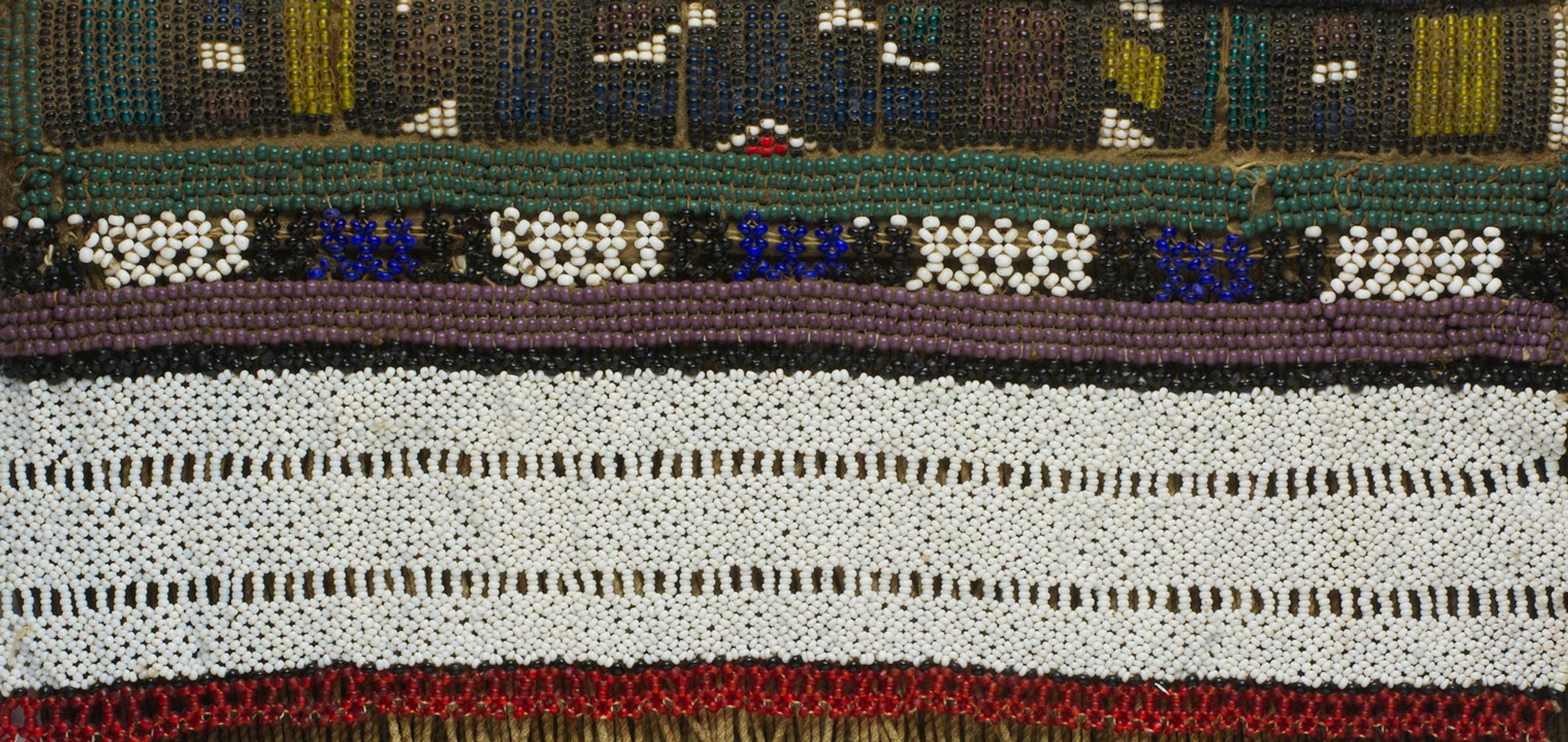 Detail view of a girl's apron made glass beads and hide