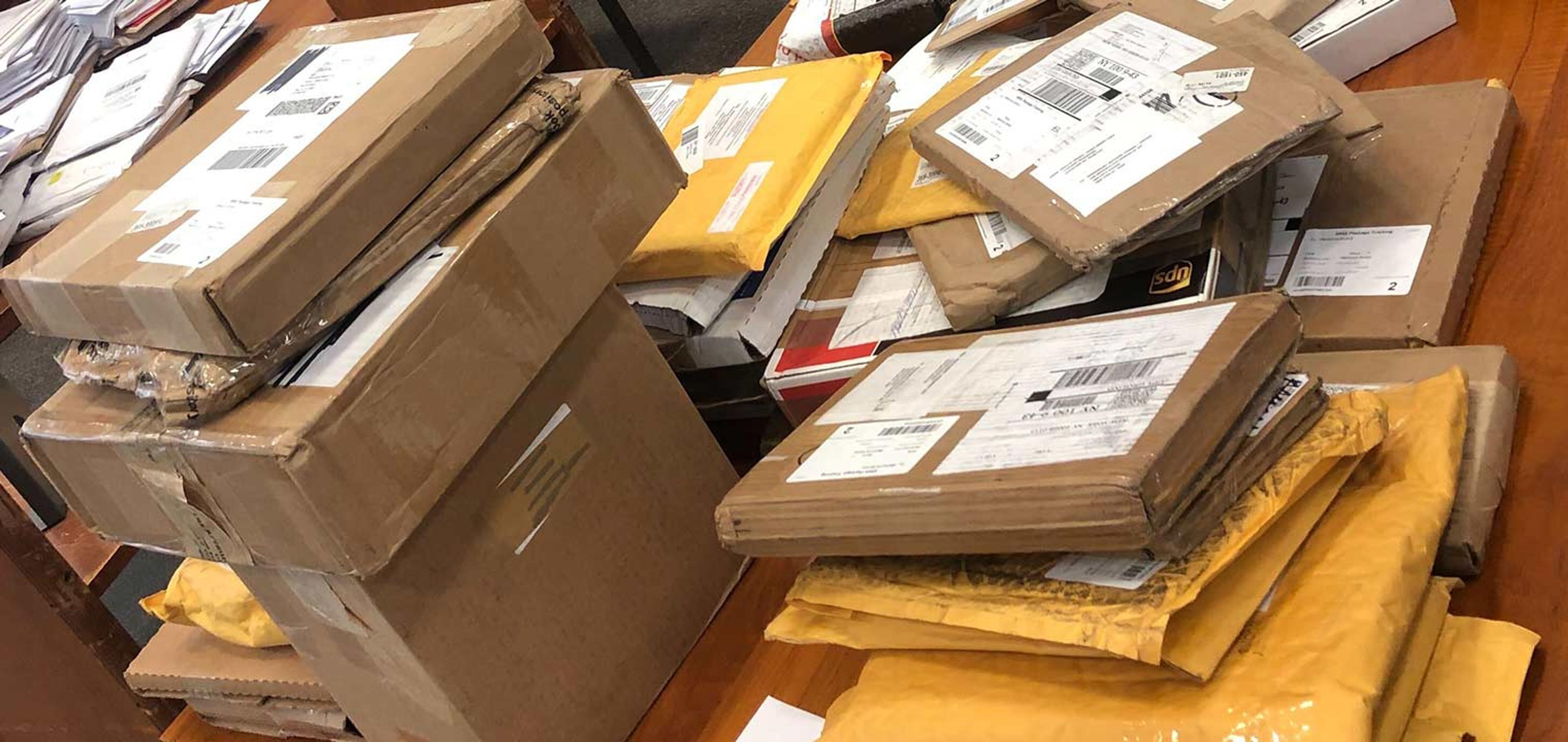 Table covered in unopened boxes.