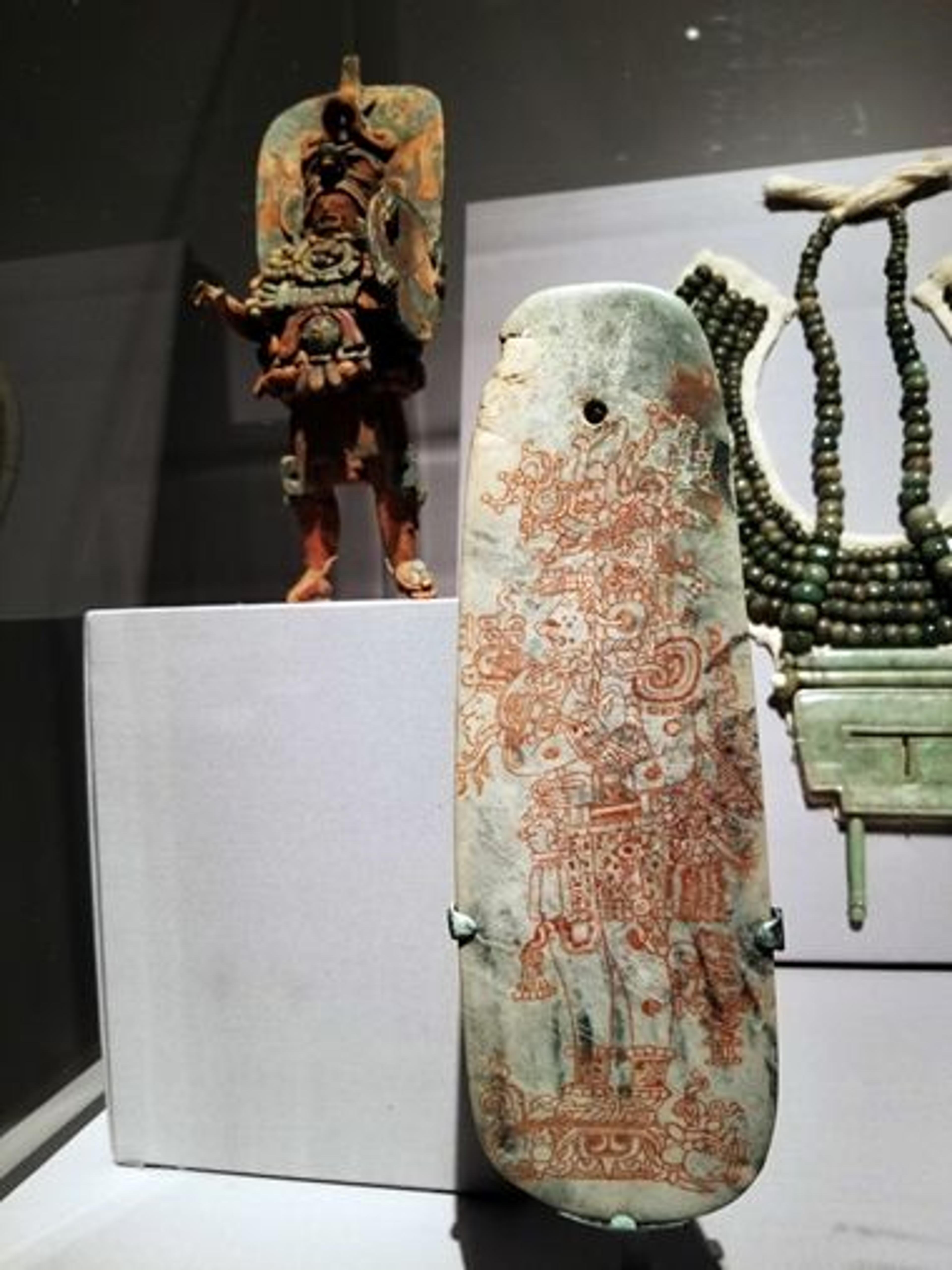 Installation view of a jadeite belt ornament in the 'Golden Kingdoms' exhibition galleries
