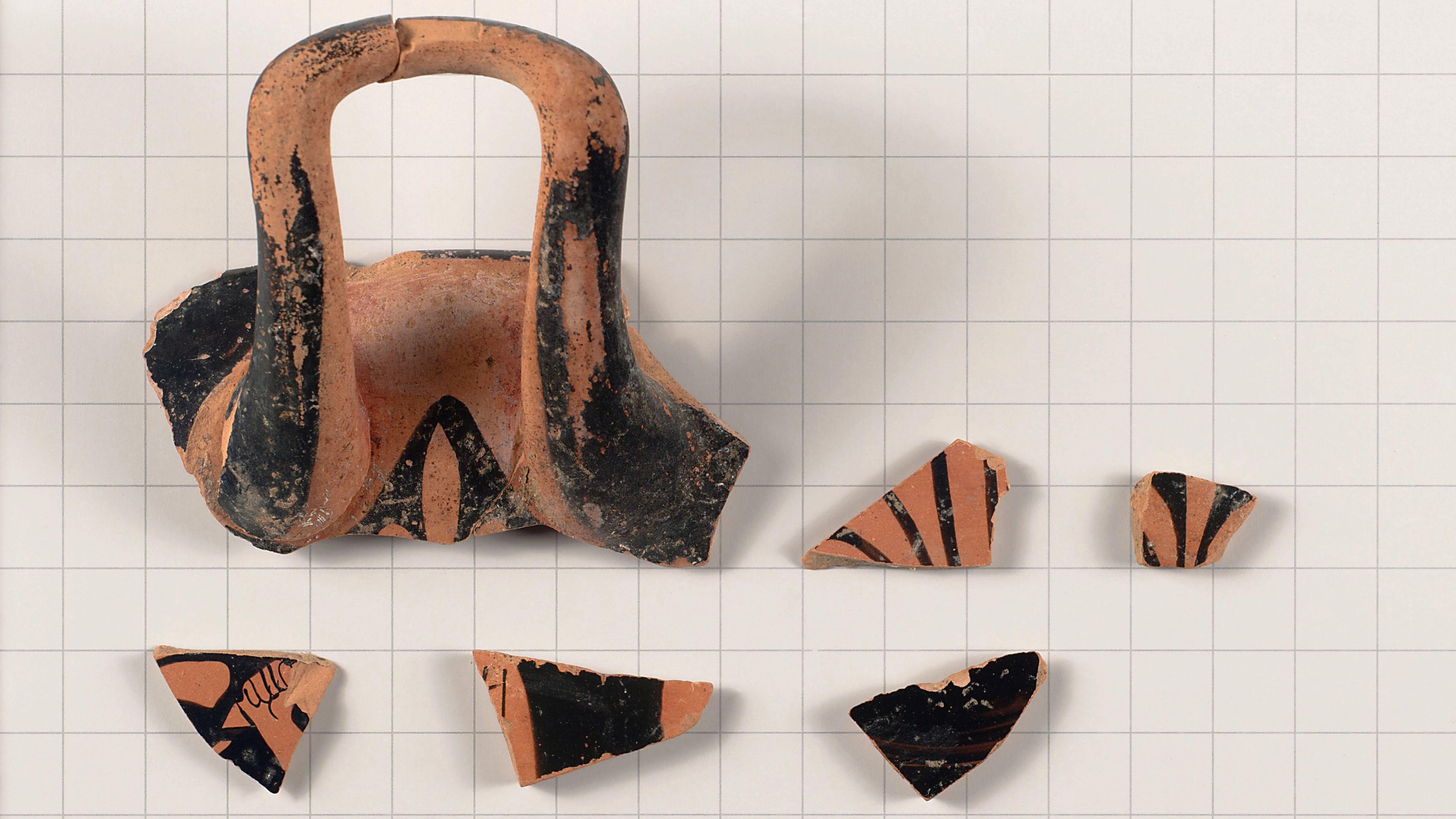 Fragments of a Greek terracotta drinking cup