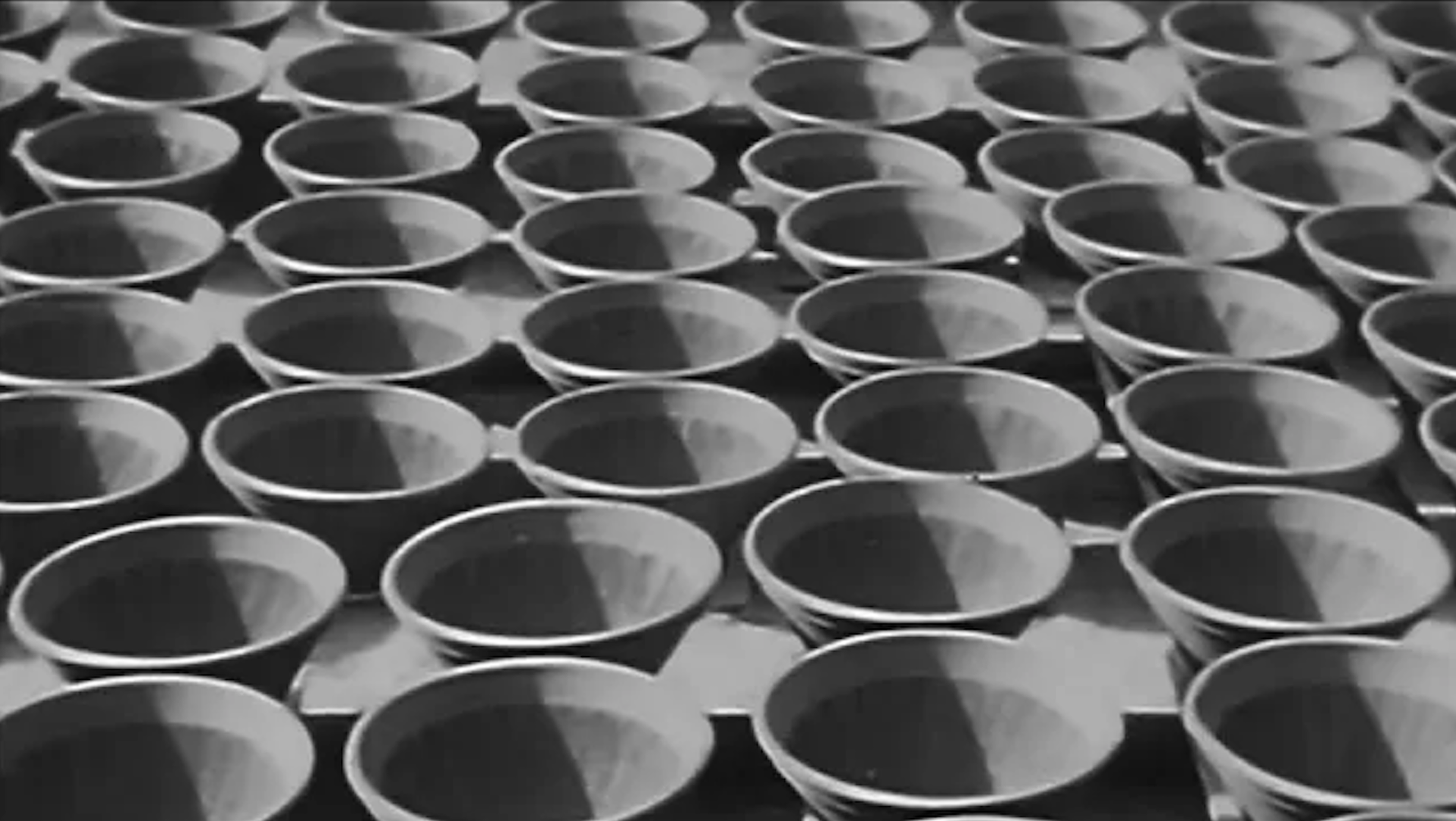 Rows and rows of freshly made pieces of Japanese pottery.