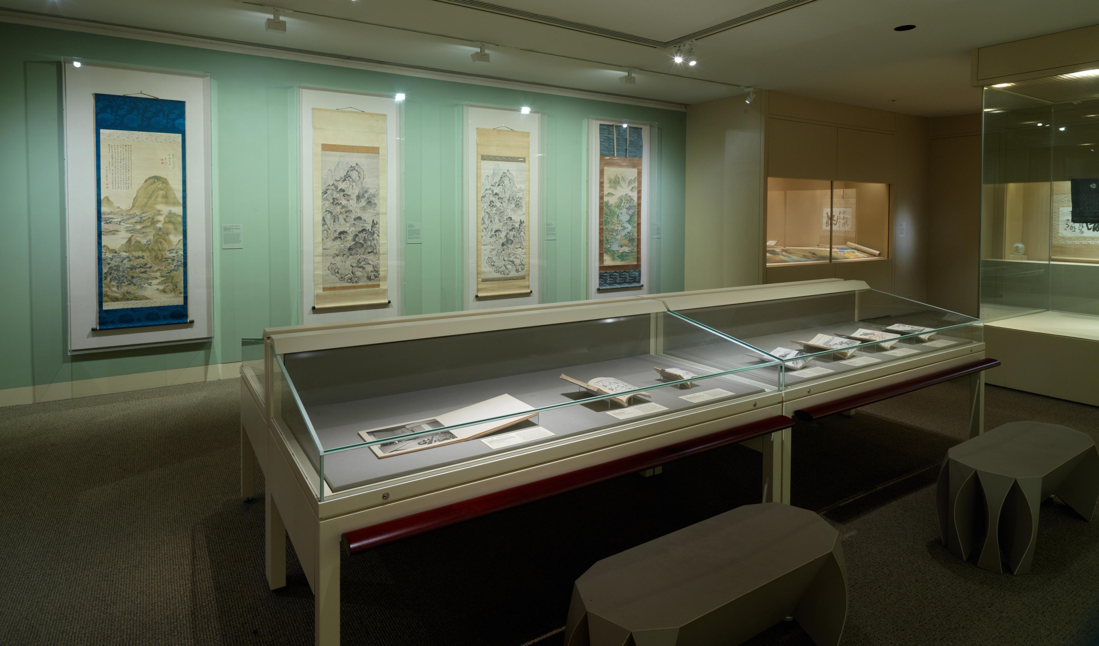 Long display case of books within an exhibition
