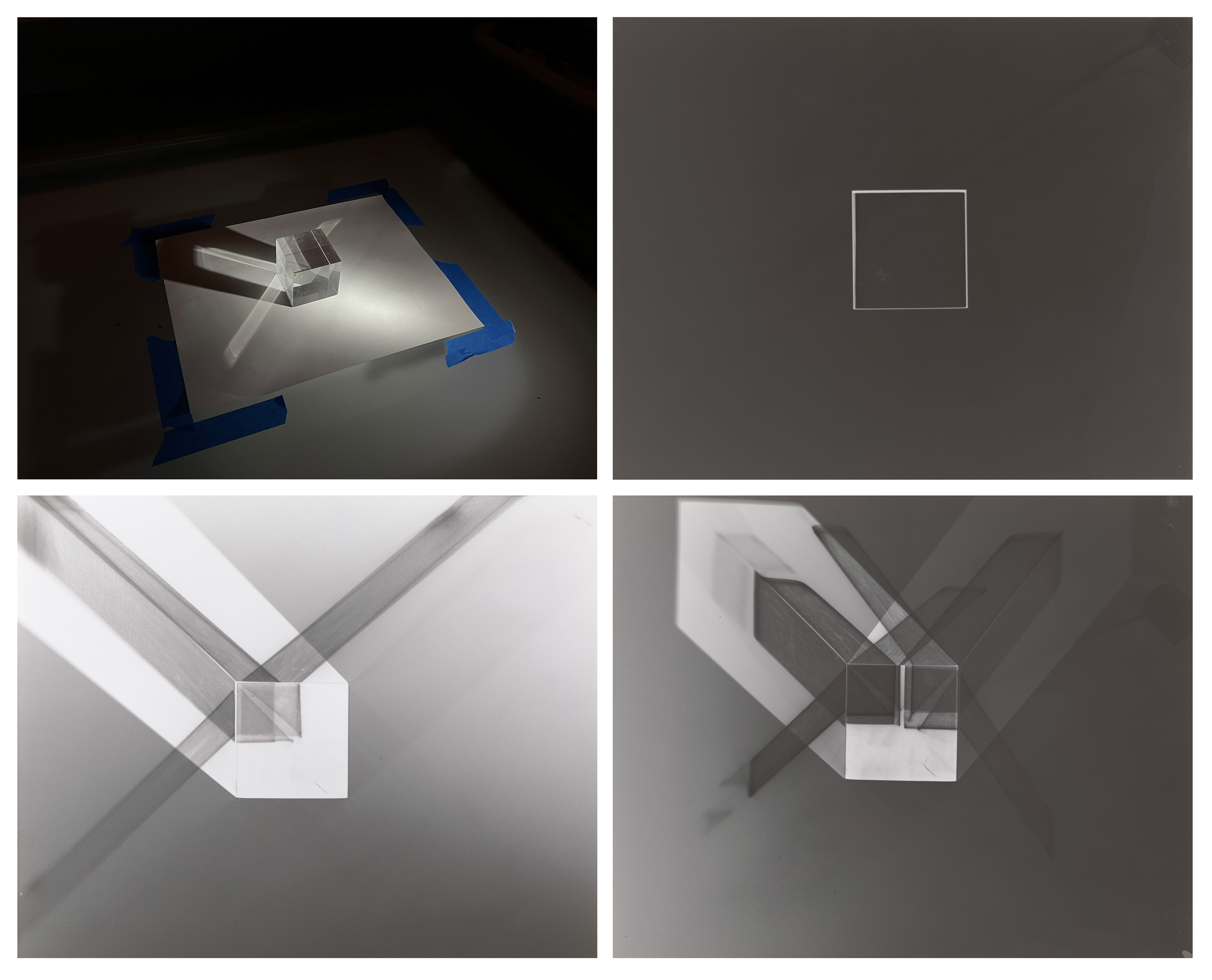 Grid of four black and white photograms depicting darkroom experiments using a piece of paper and a prism.