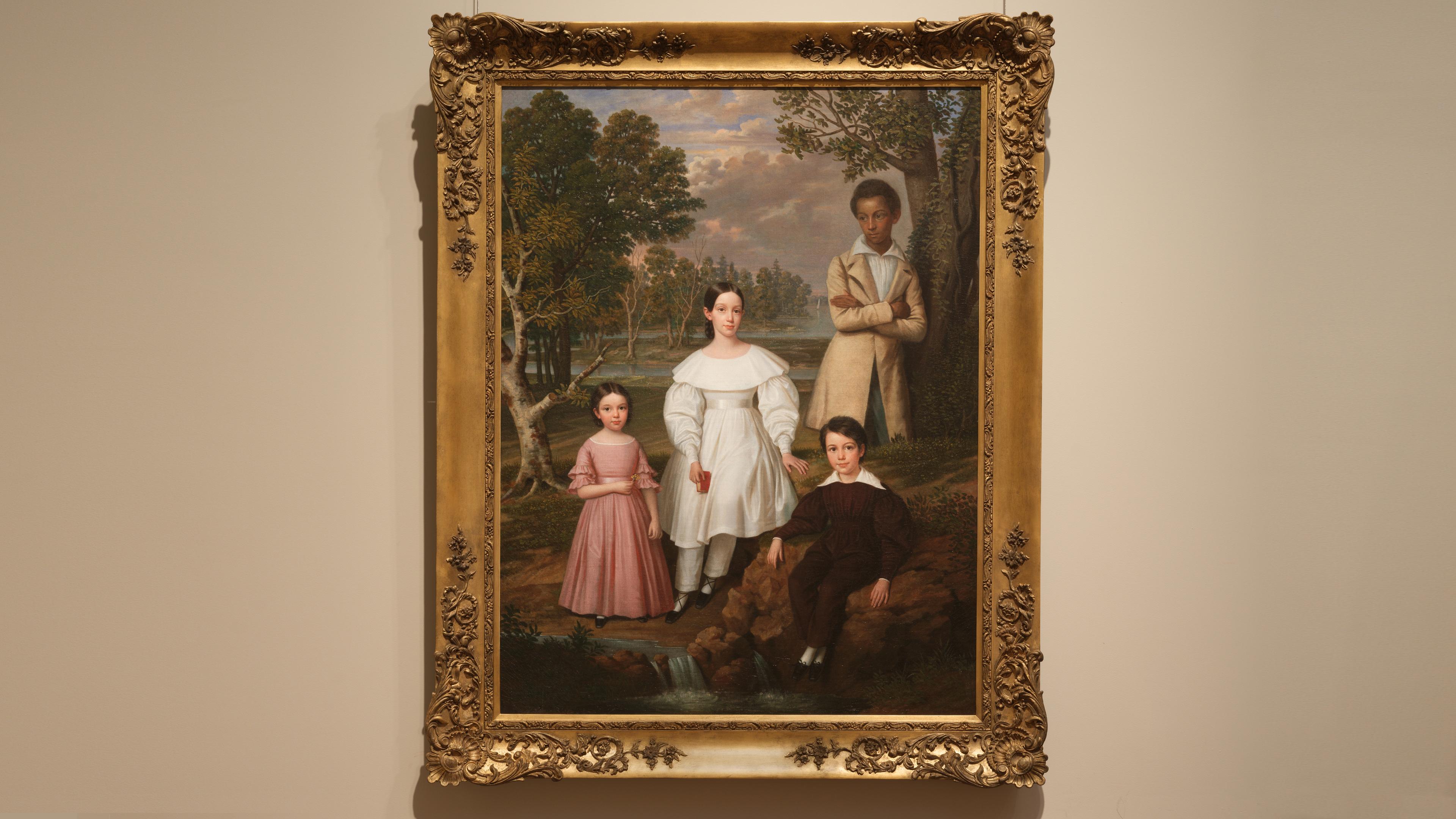 Portrait of a Black teenage boy and three white children positioned against a Louisiana landscape.